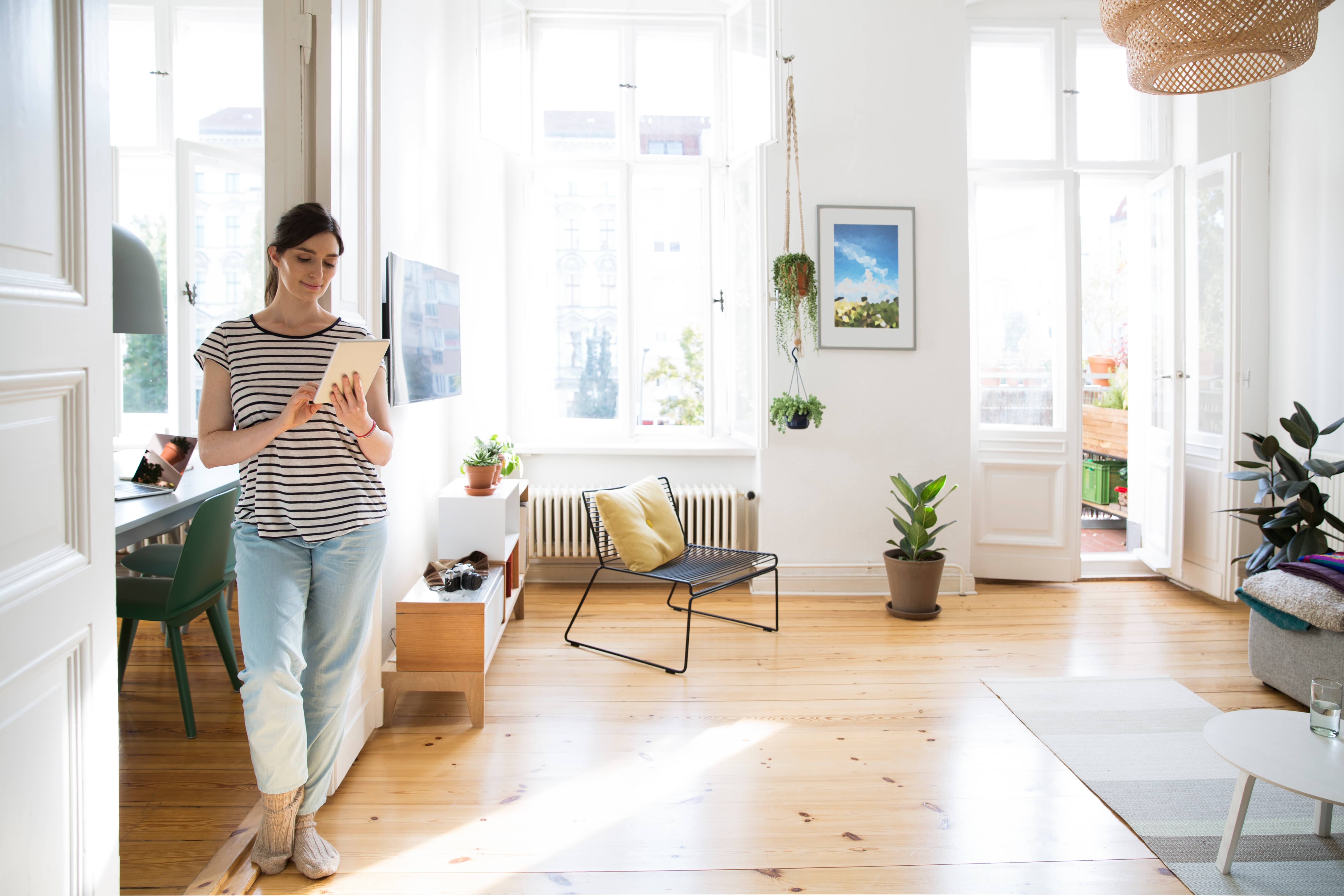 woman using tablet in living room