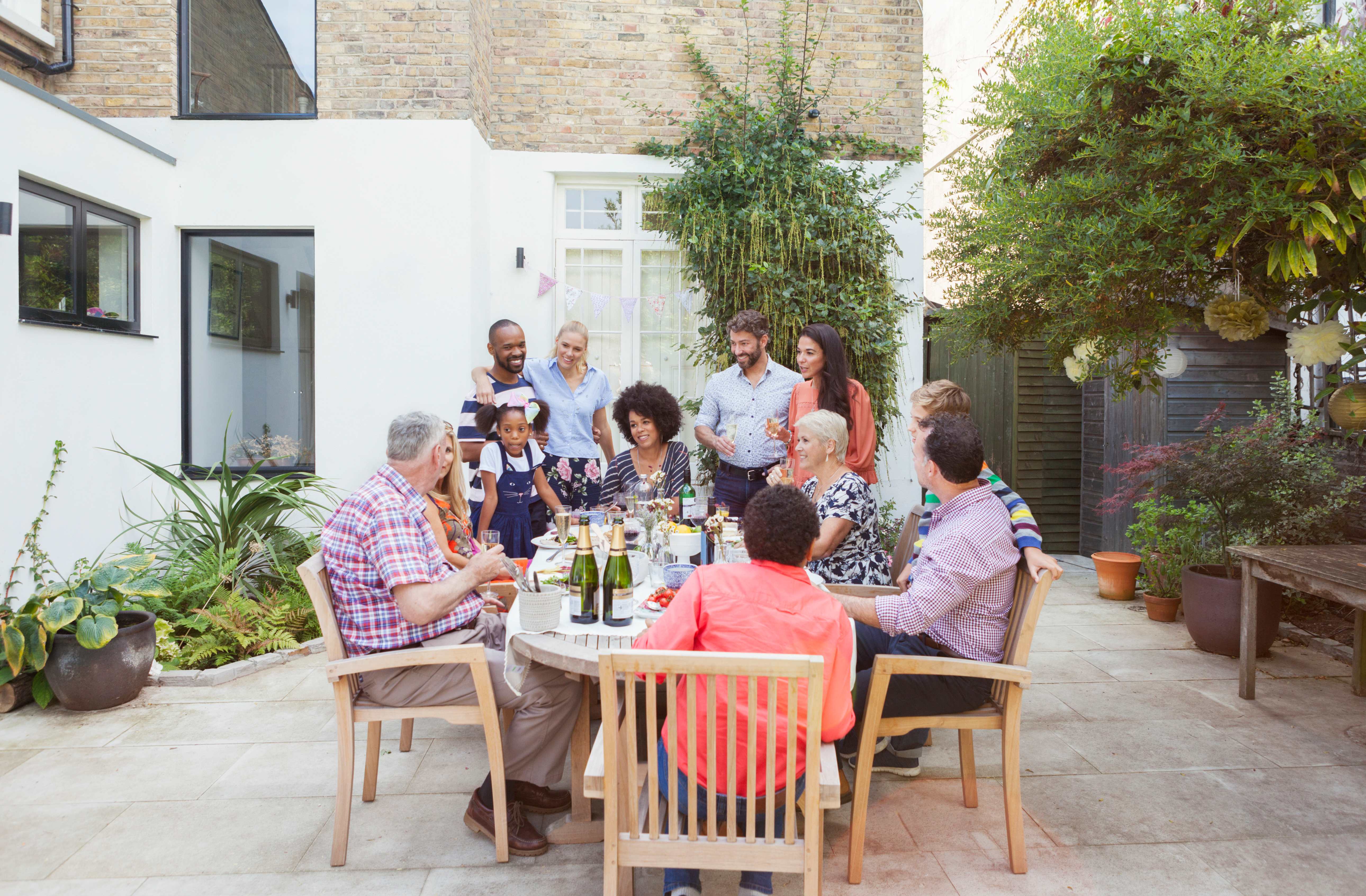 Family and friends enjoying dinner on the patio