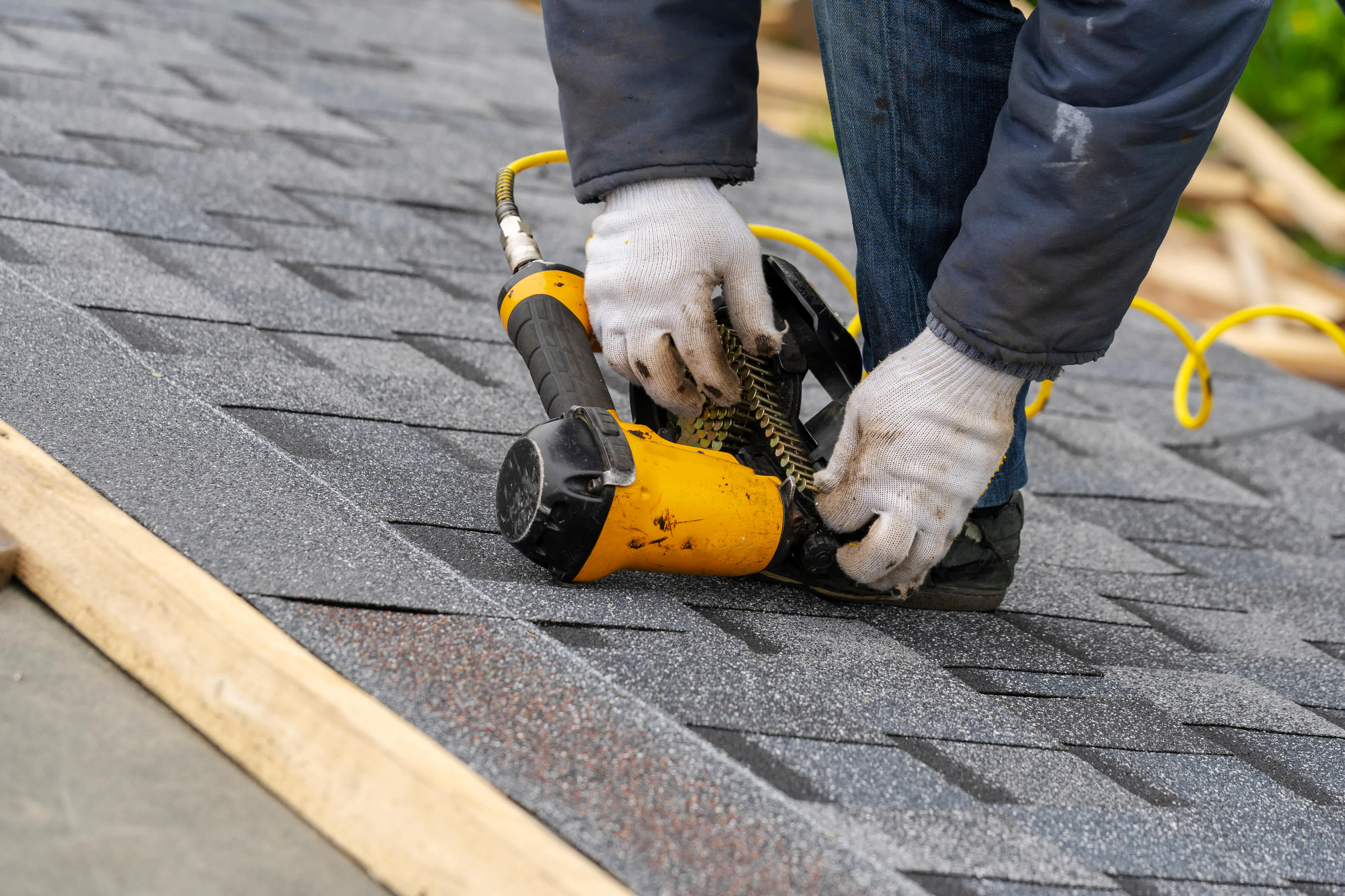 Worker installing asphalt
