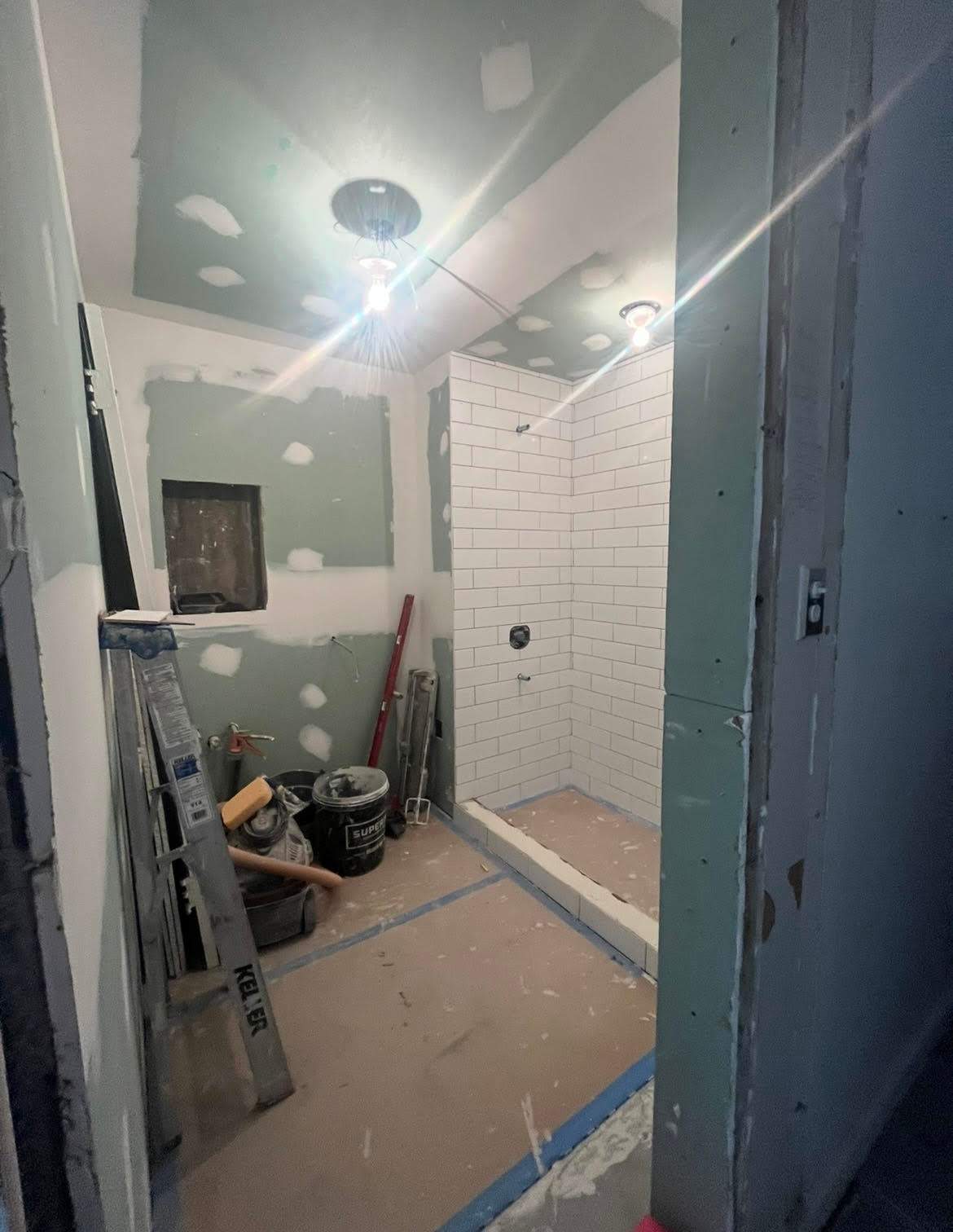 Remodel of an apartment bathroom with contractor tools