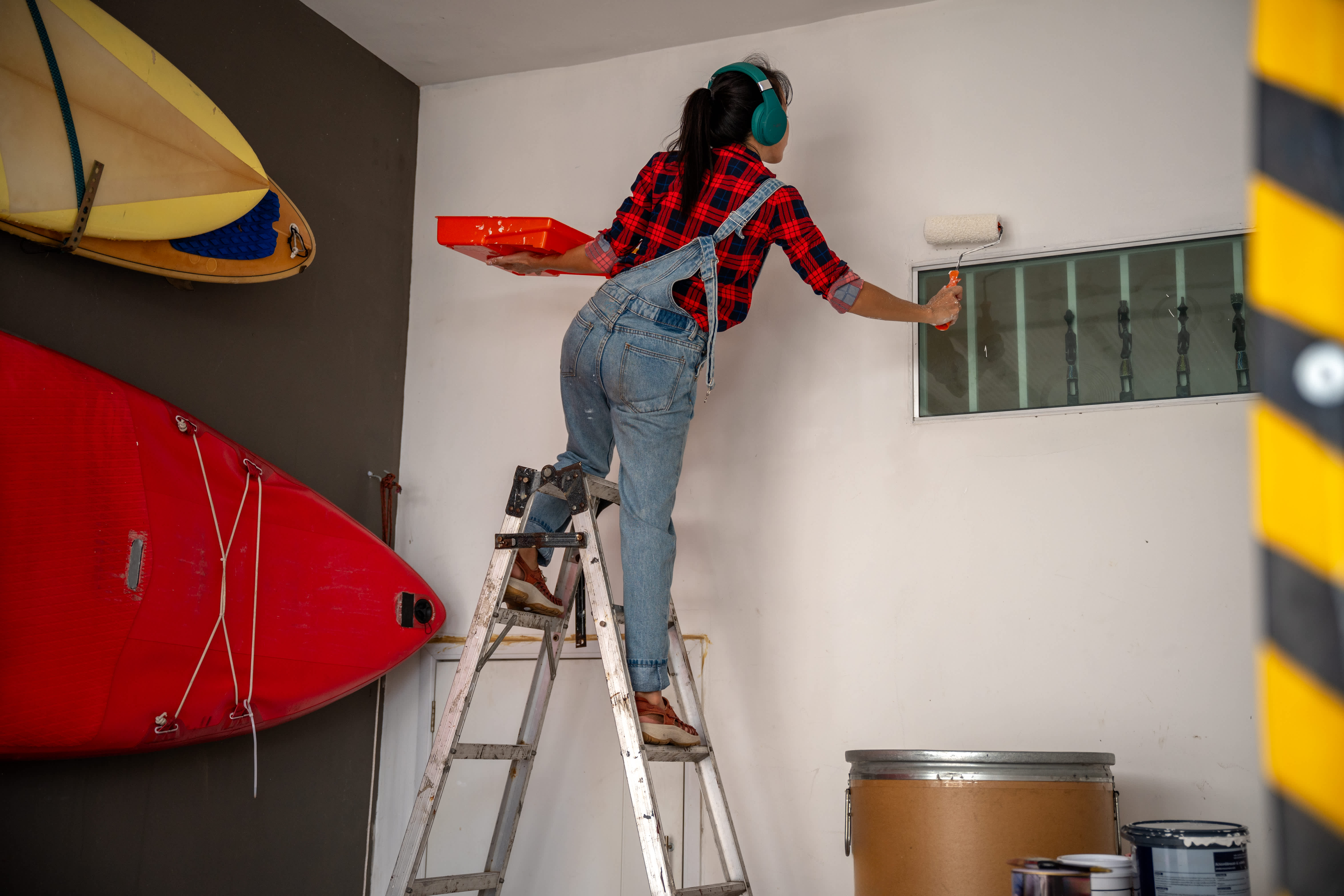 A woman remodeling her garage