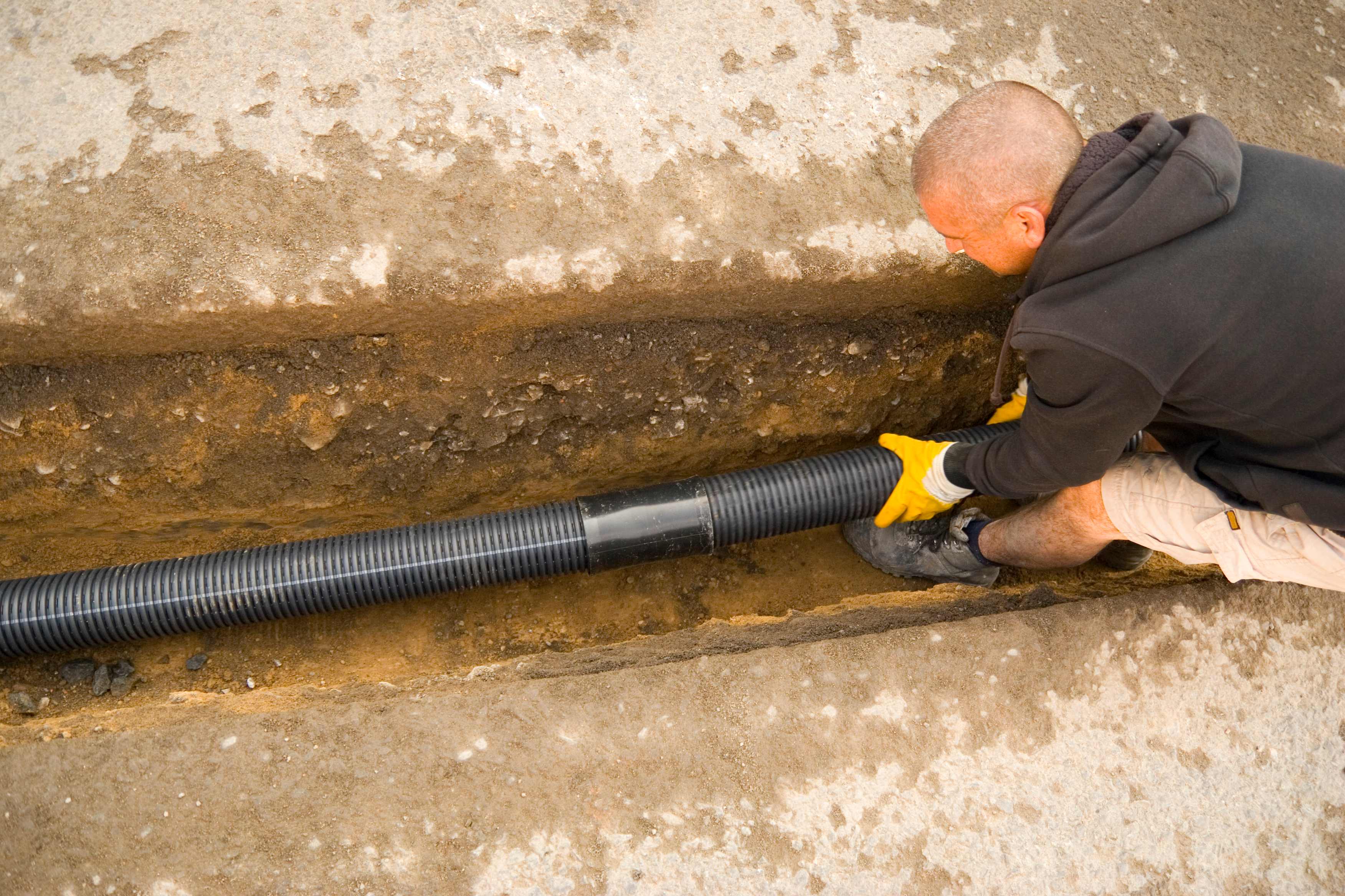 A professional connecting a septic system