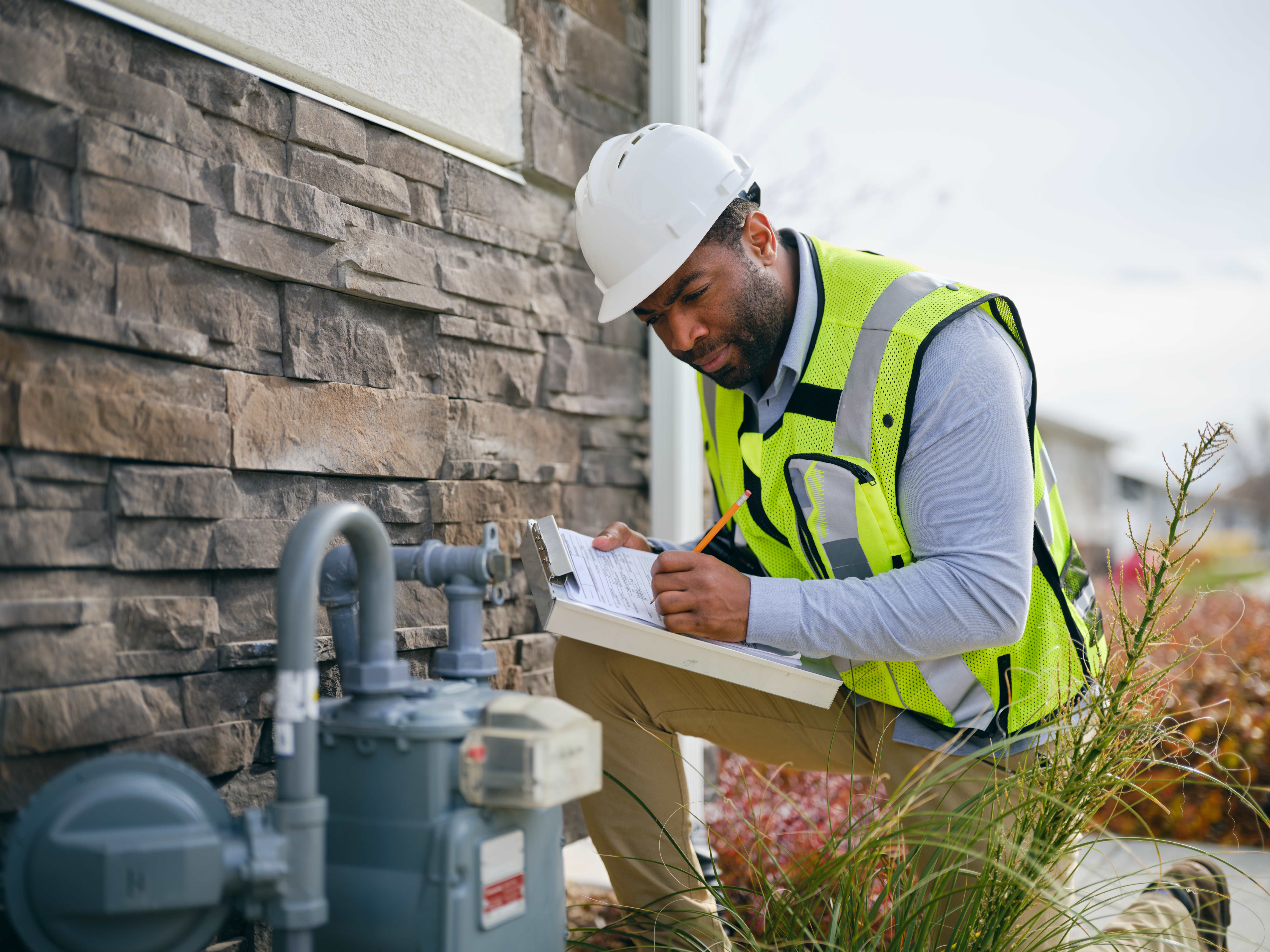 A man performing a sewer inspection