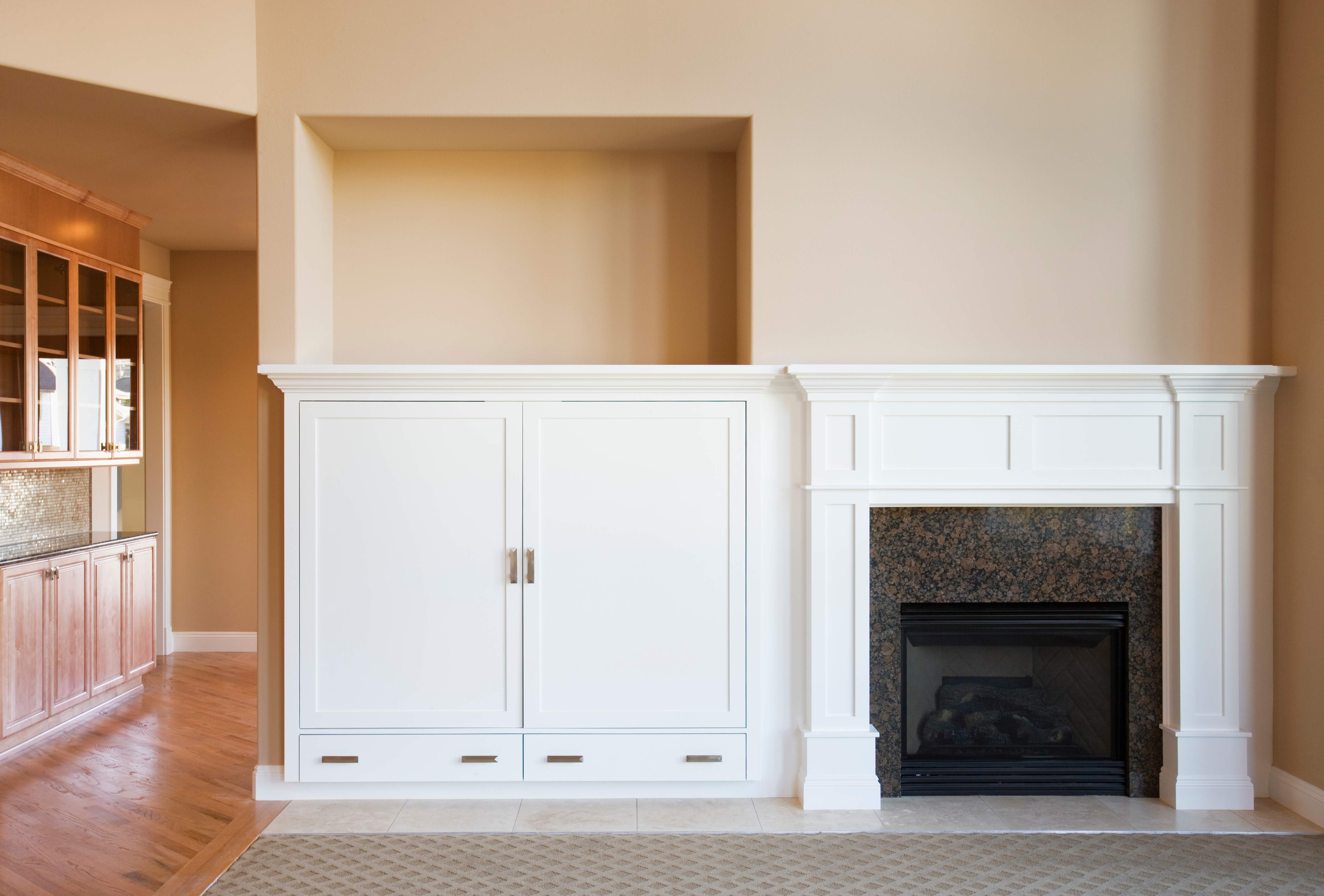 A fireplace in empty living room