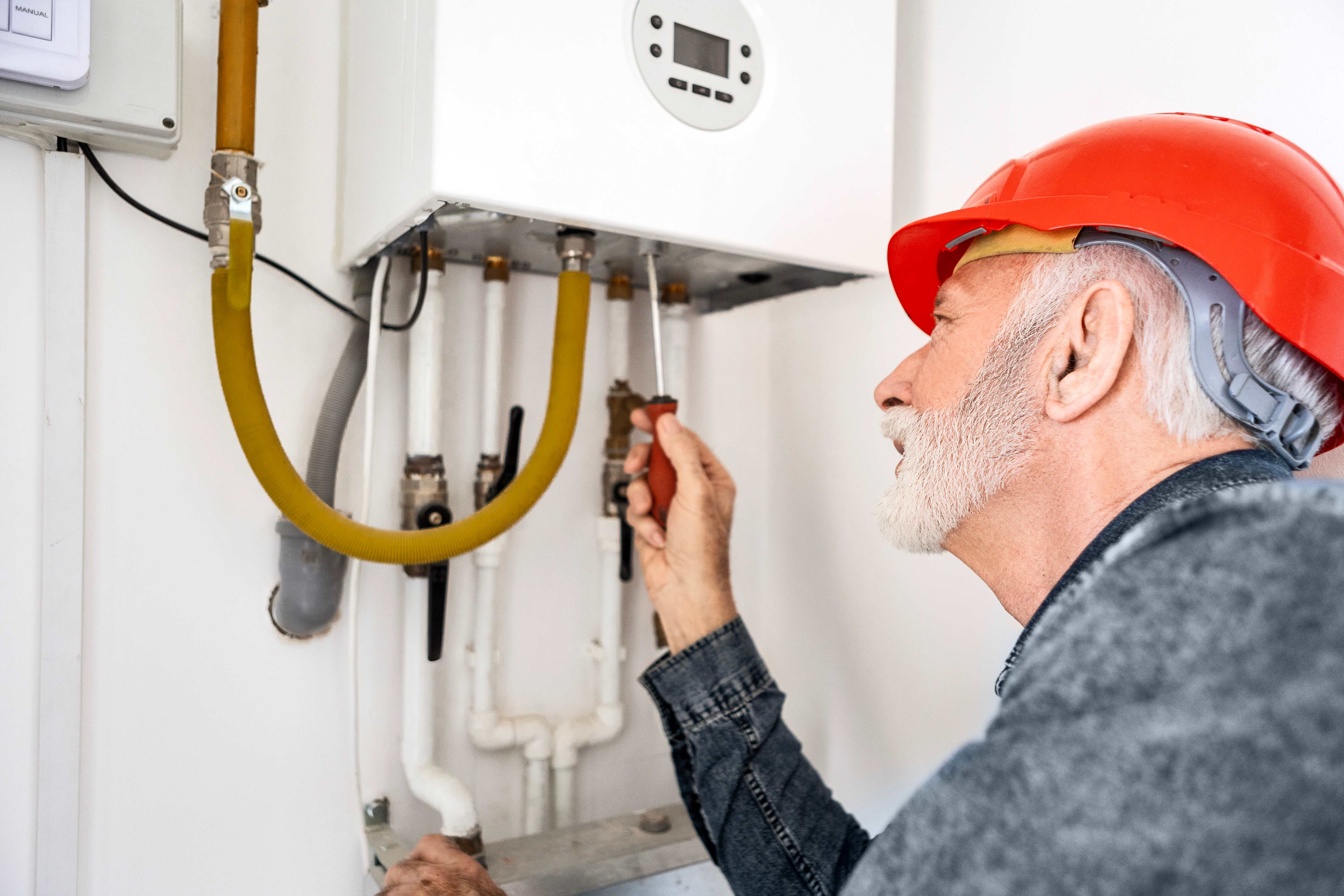 A technician checking the piping system