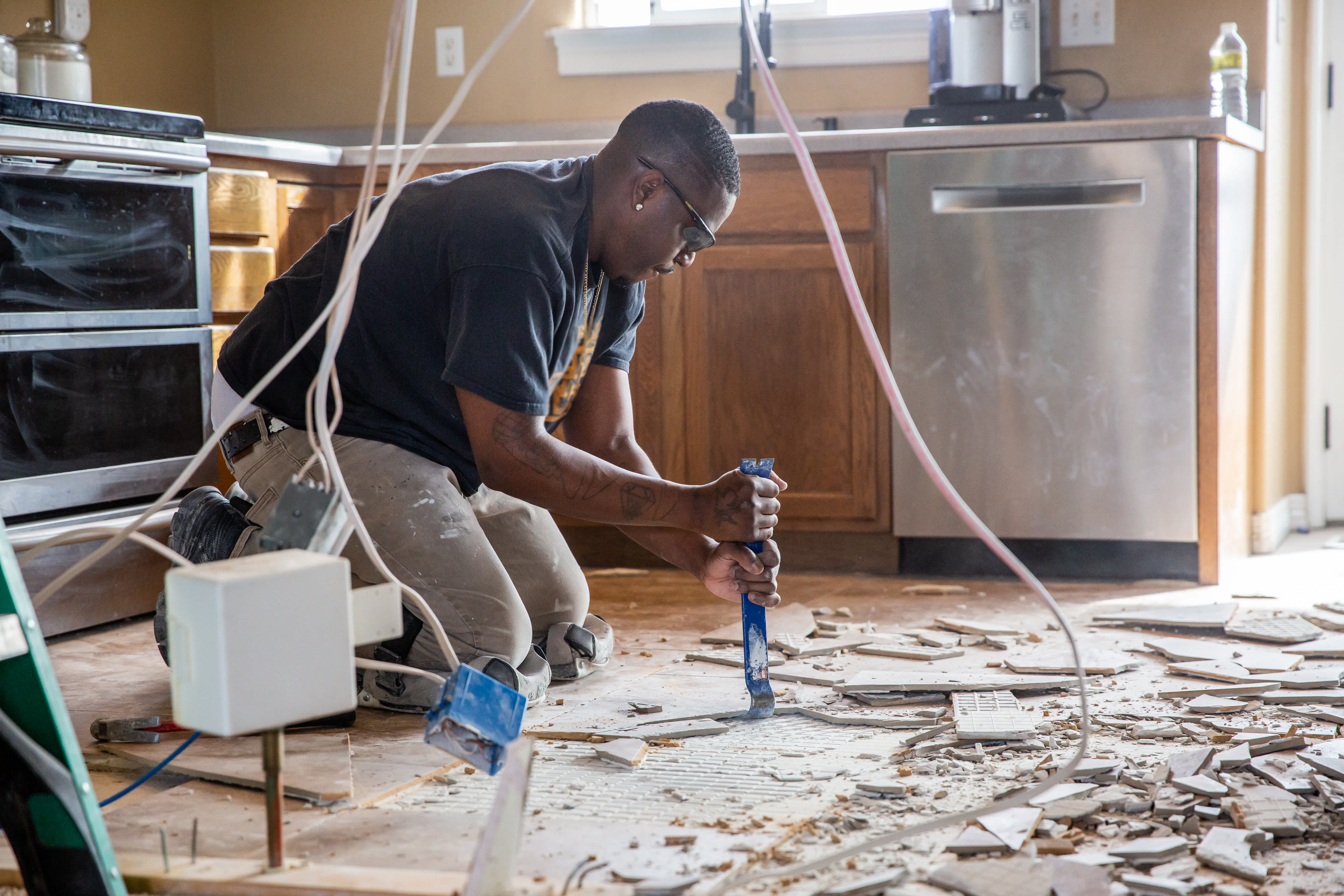 worker-removing-kitchen-tiles-1391664751