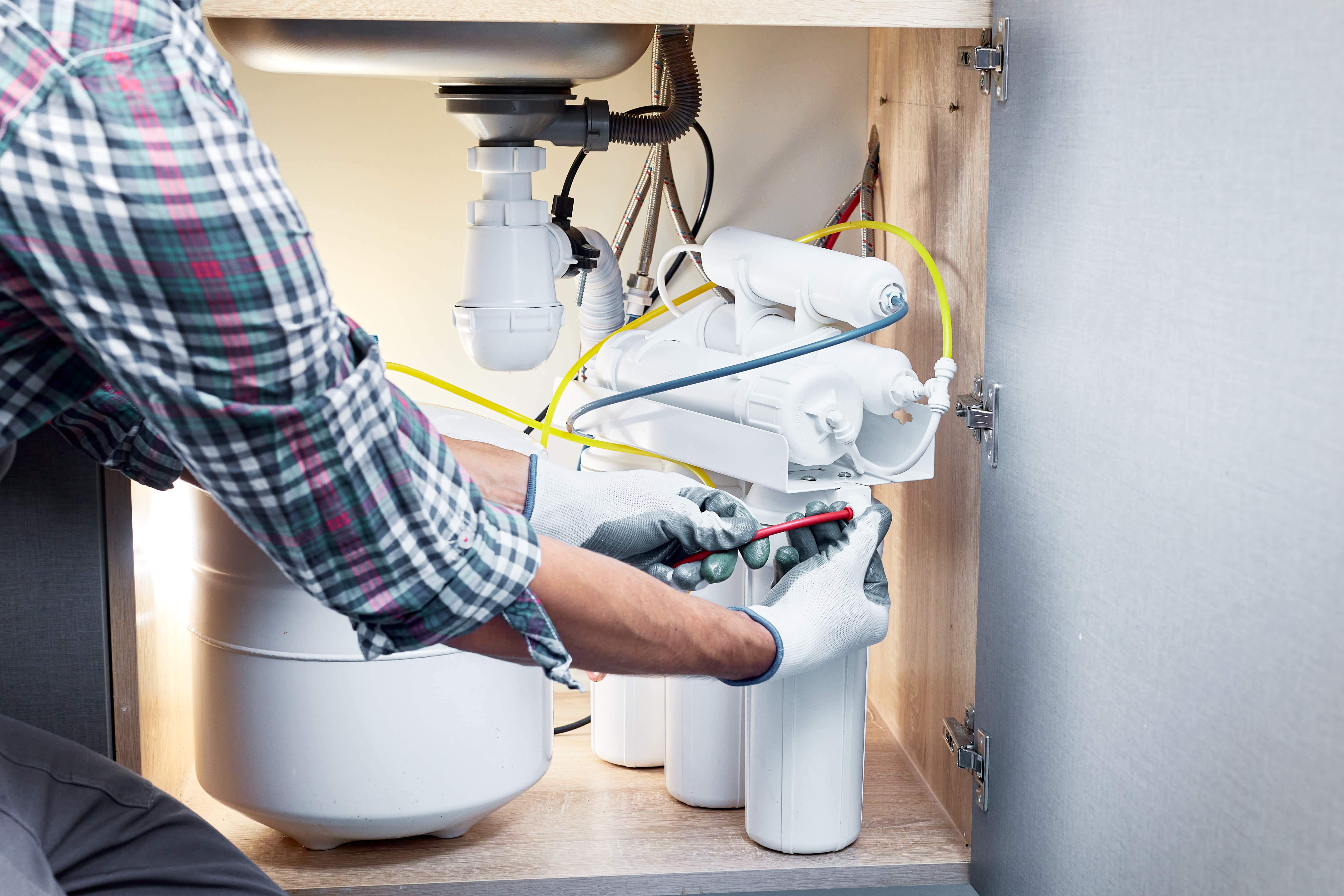 Technician installing water system