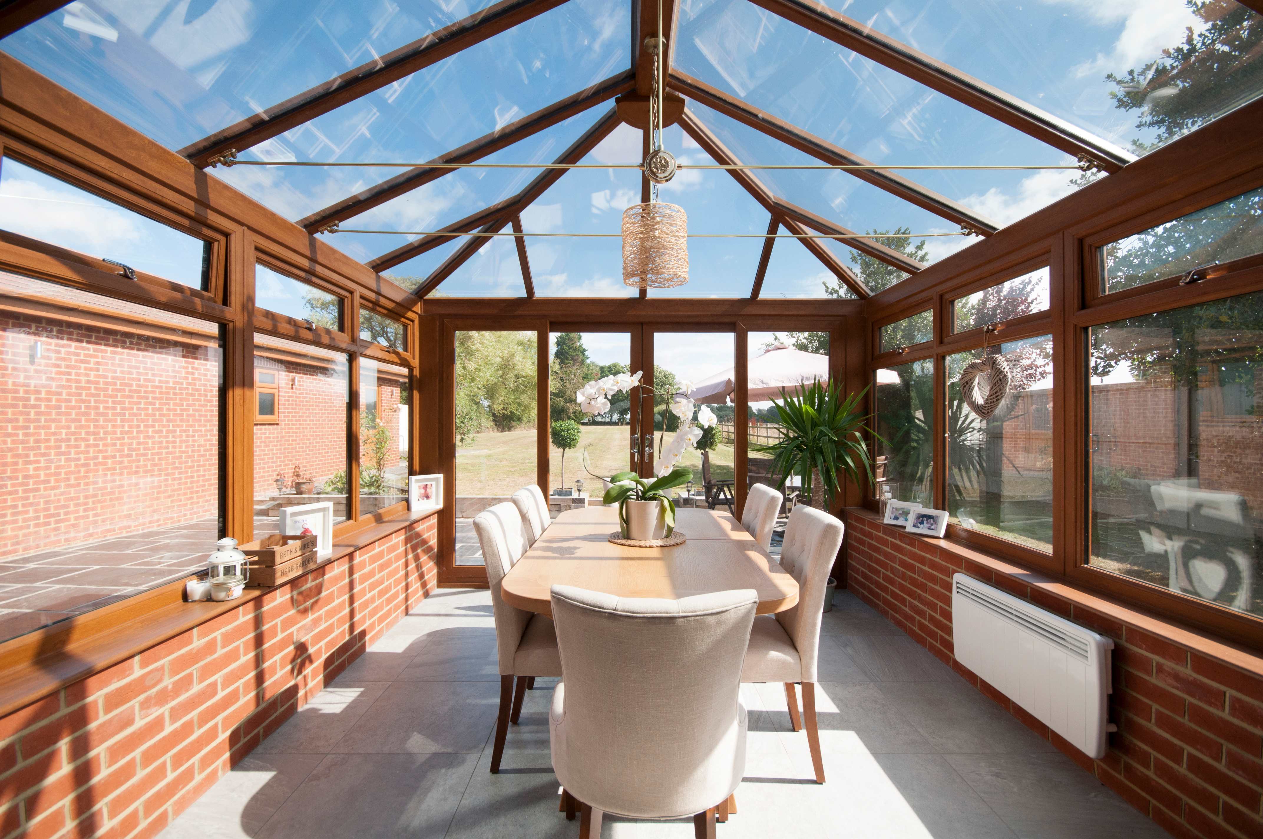 A sunroom with a dining table