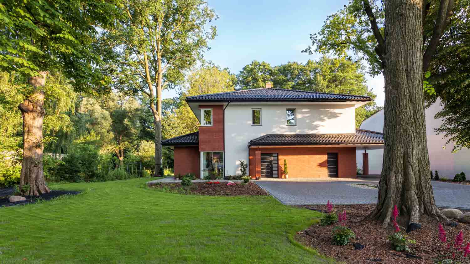 summer house with tree in front