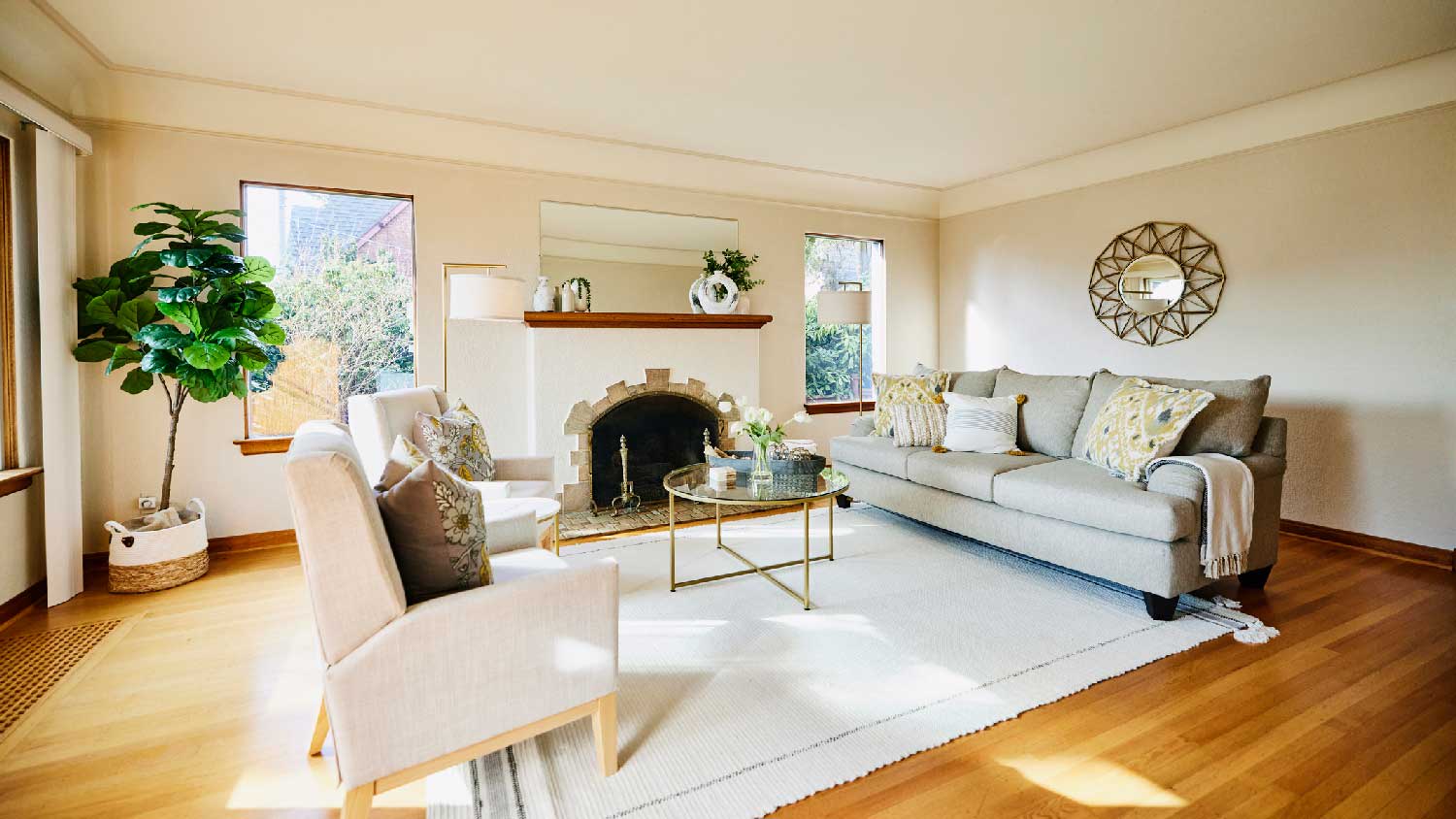 The interior of a living room with large windows