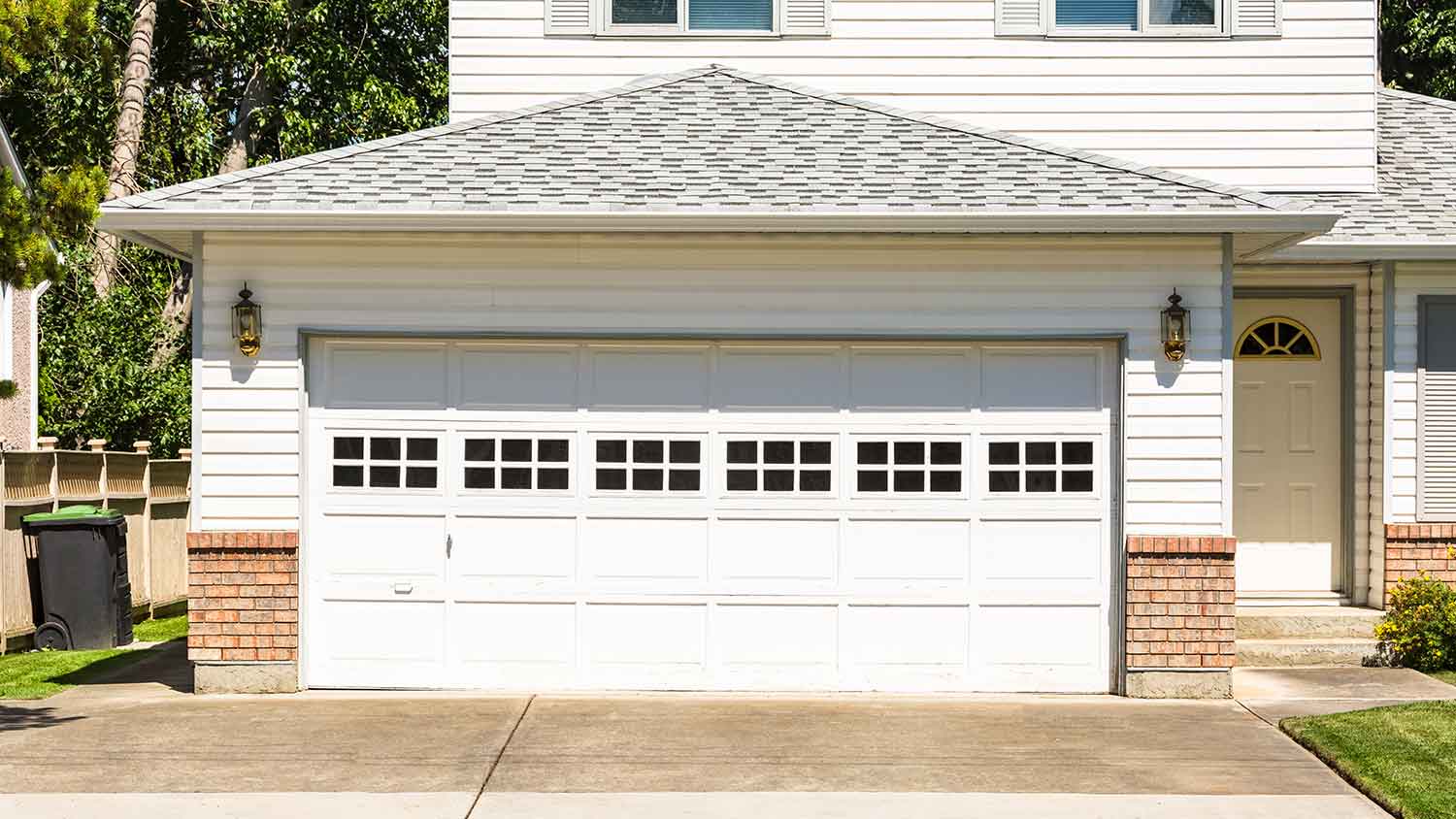House with wide garage door and concrete driveway