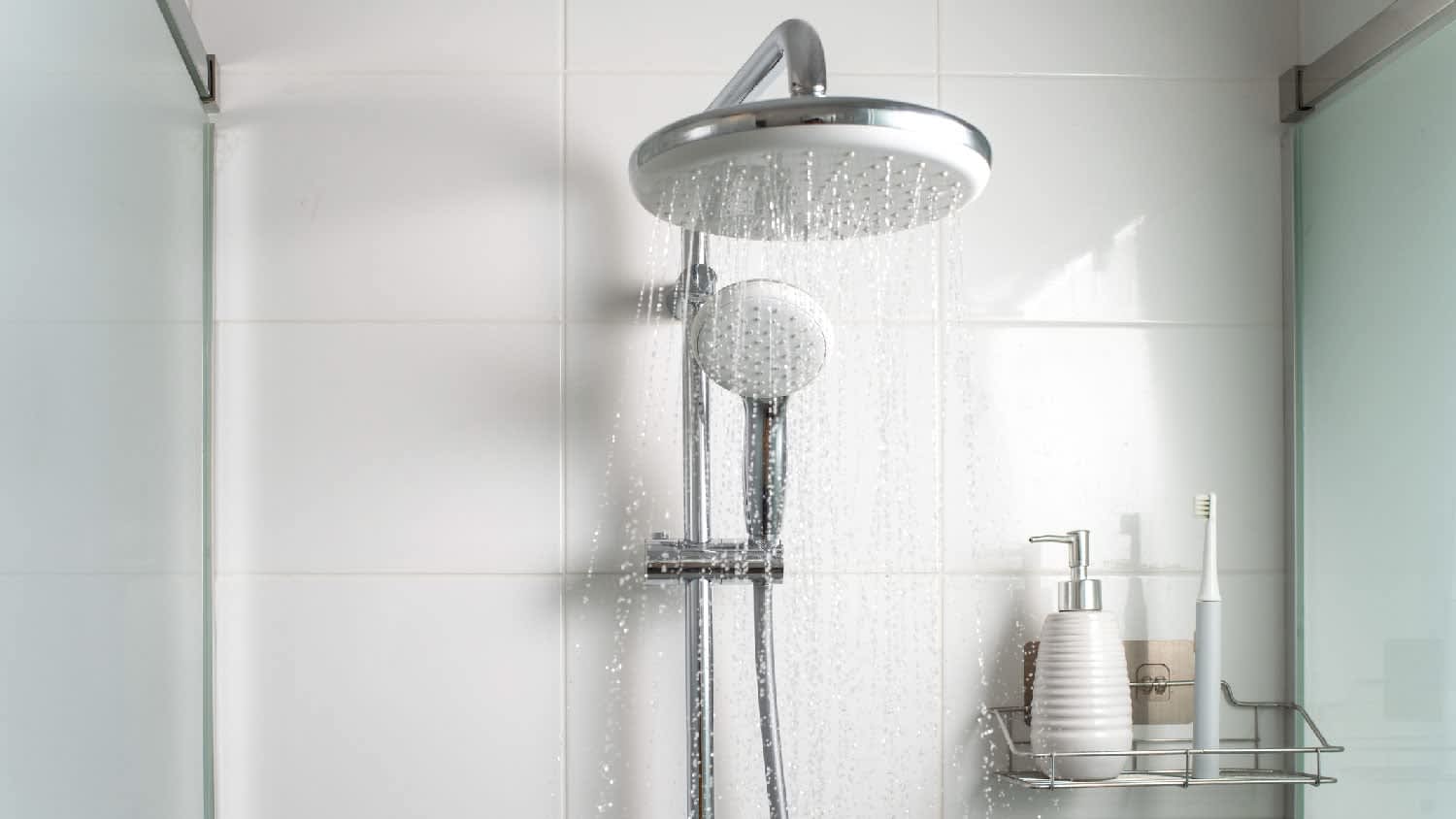 Water running from showerhead in a shower cabin