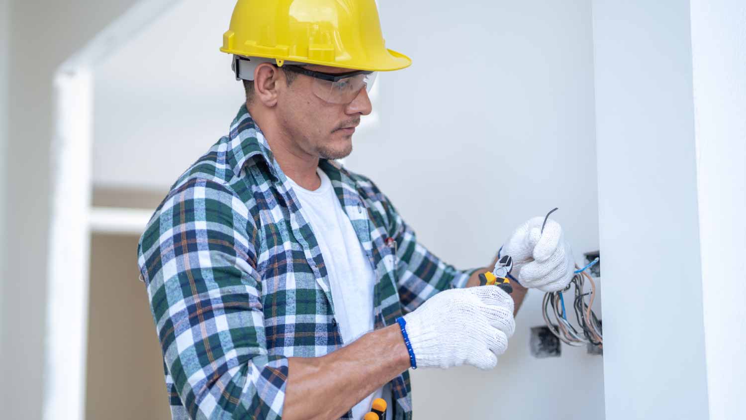 Electrician installing electric wire