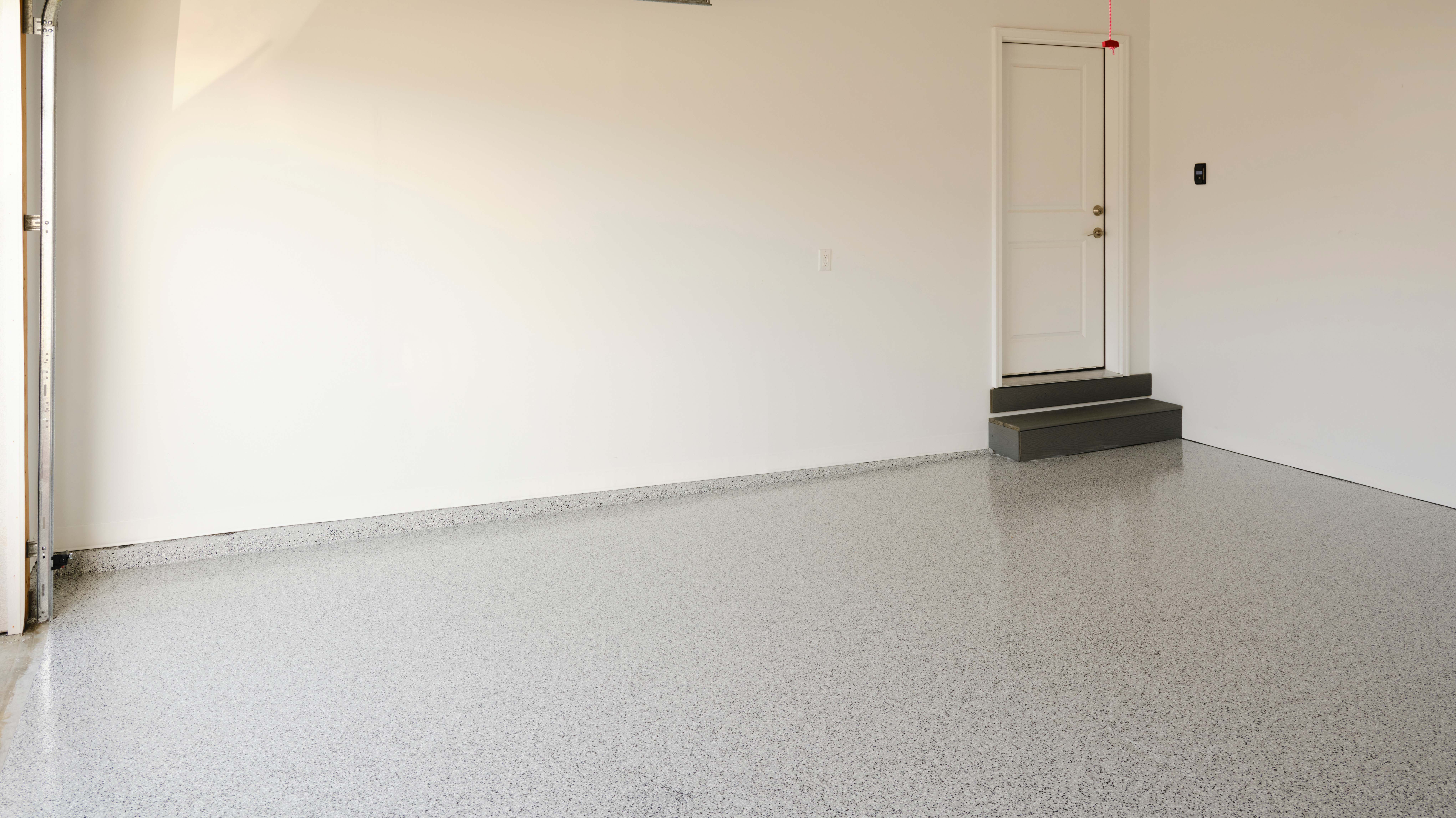 Empty garage interior with epoxy flooring