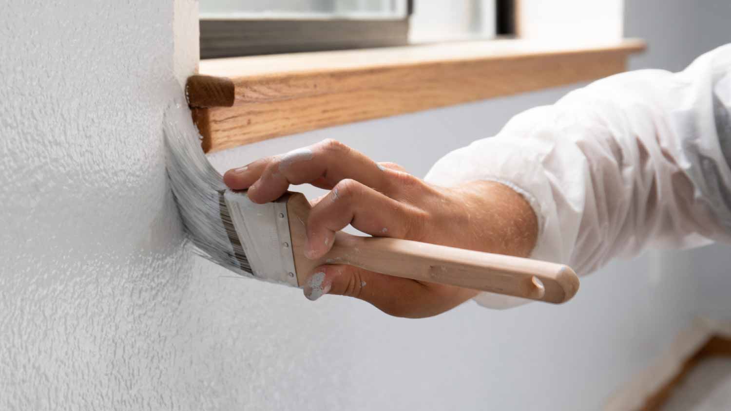 Man painting interior home