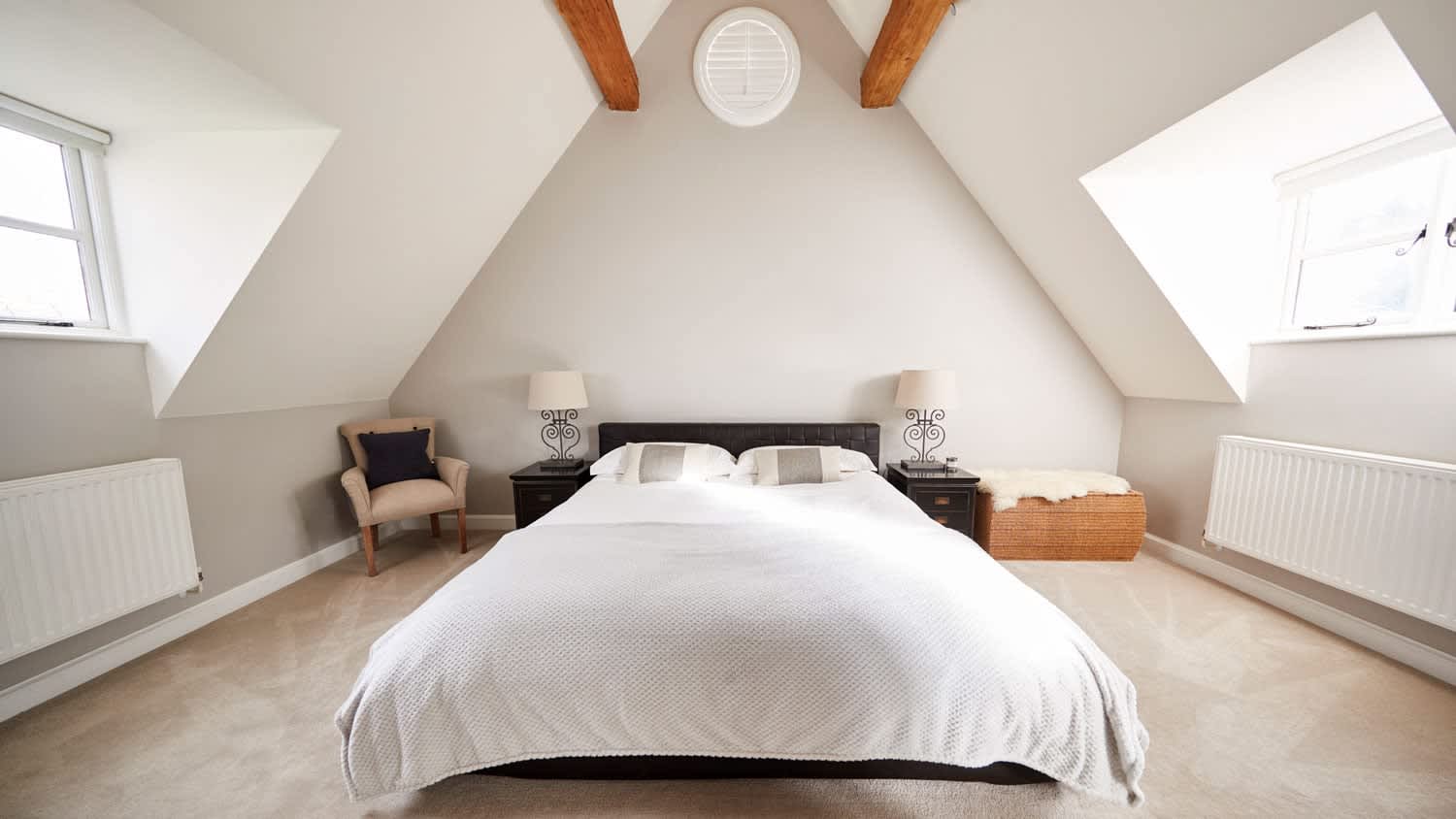 A bright attic used as a bedroom