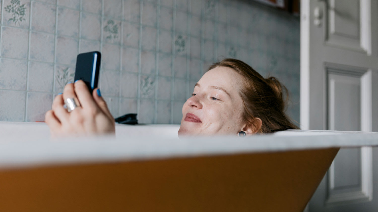 A woman relaxing in the bathtub