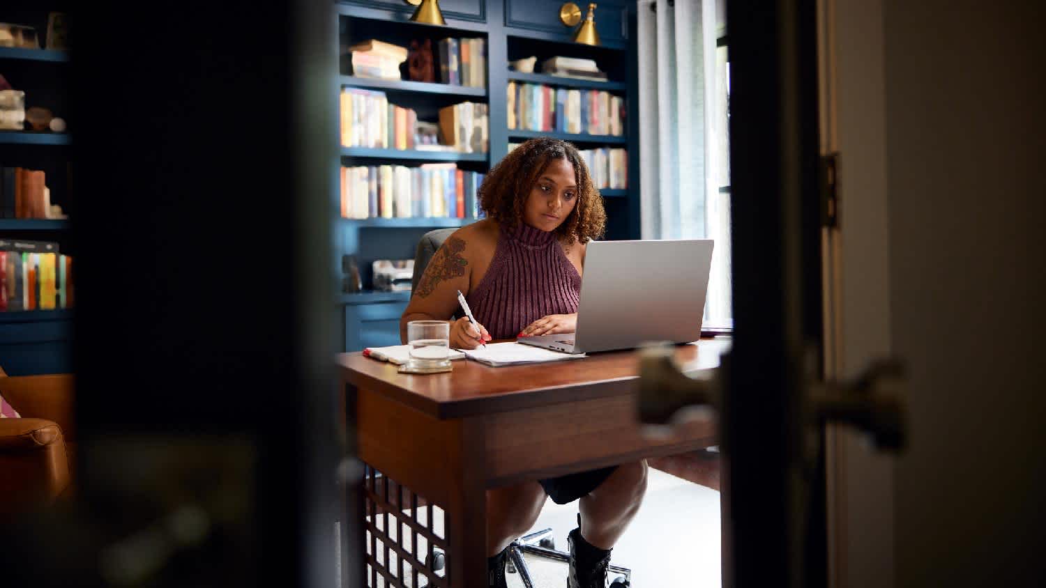 A woman working from her home office