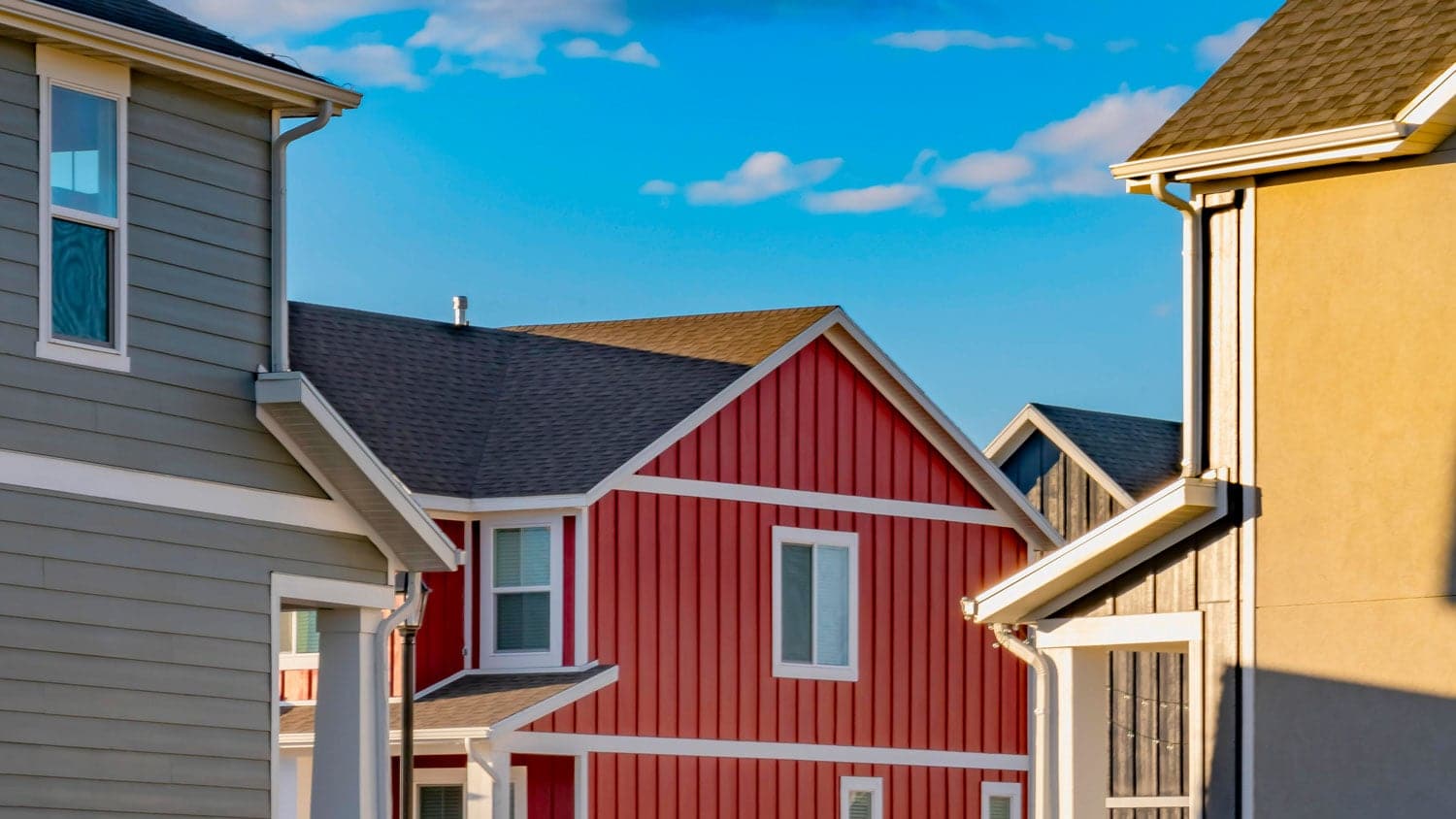 Multiple houses with different color siding.