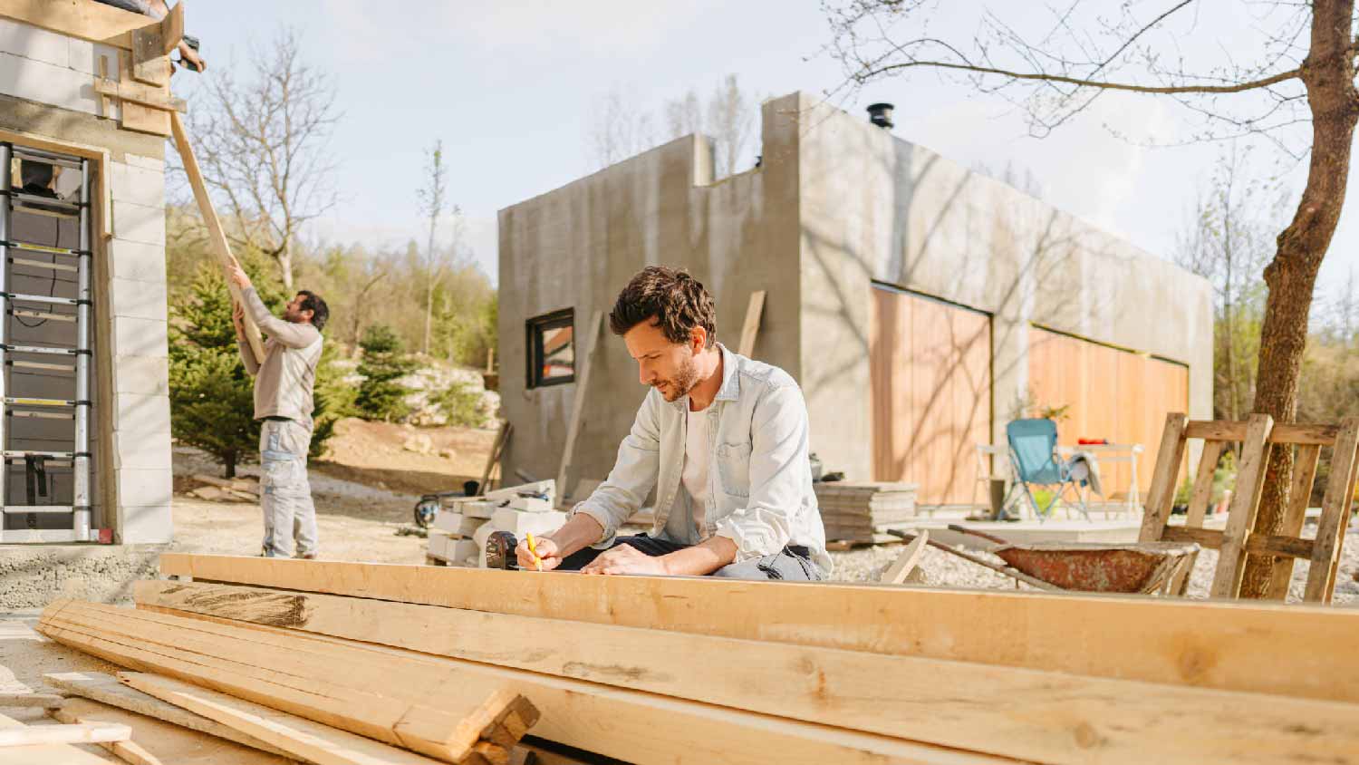 A carpenter organising lumber