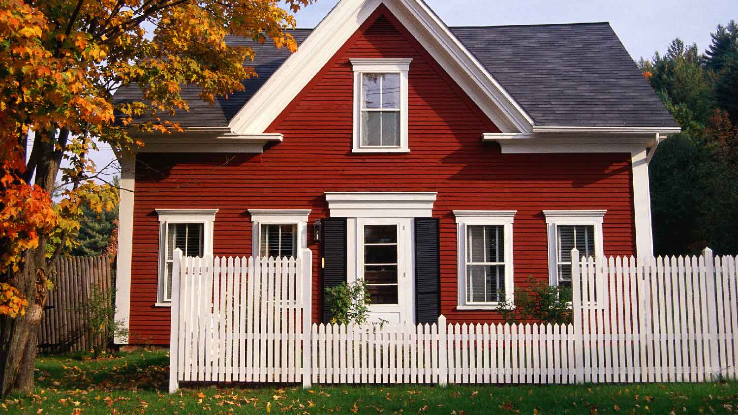 A beautiful house with white painted picket fence