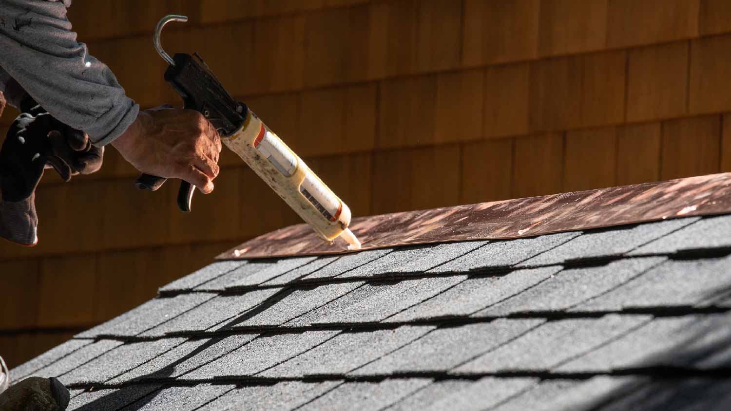 A professional installing a new copper strip
