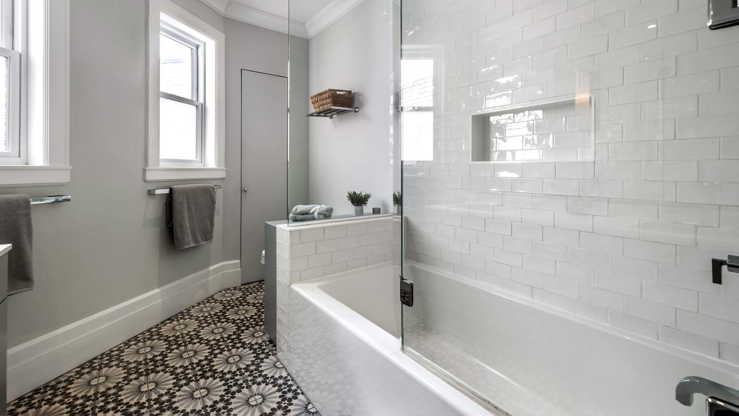 fully renovated gray bathroom