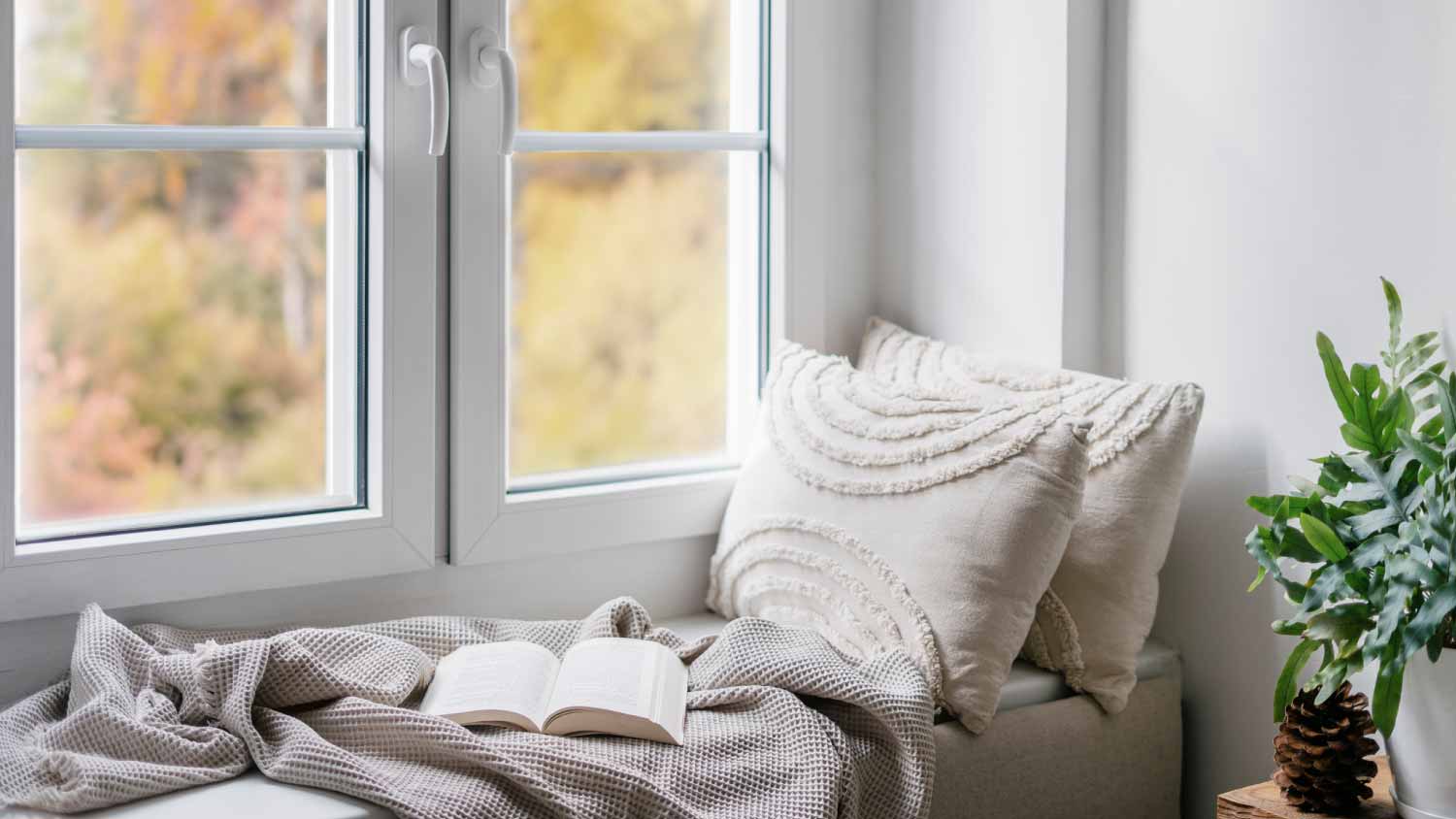 Cozy windowsill with blanket