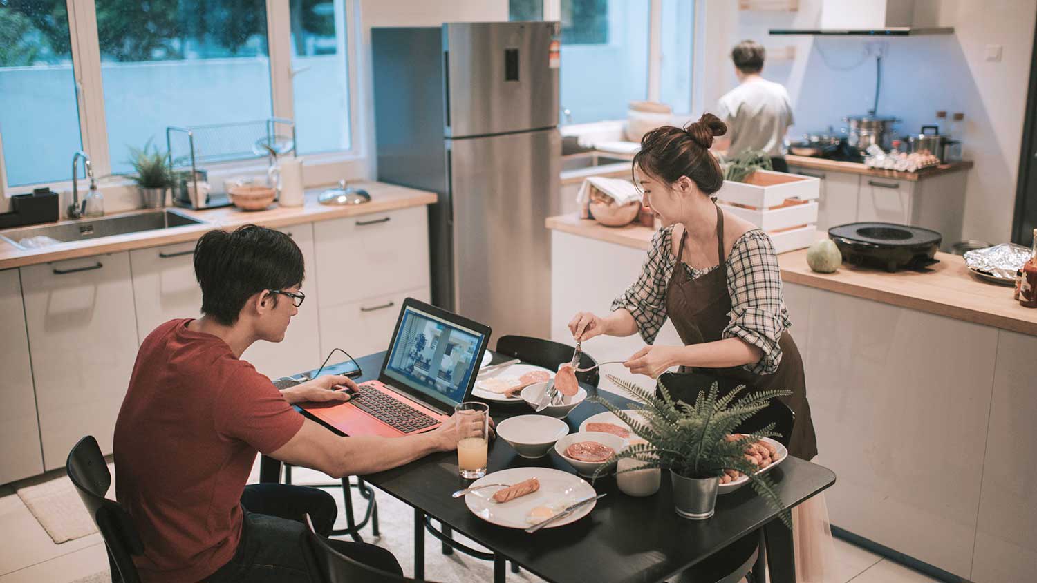 Family making a meal and spending time in the kitchen