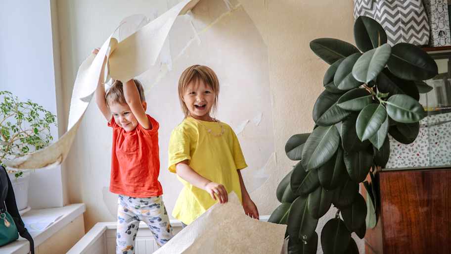 kids playing with wallpaper