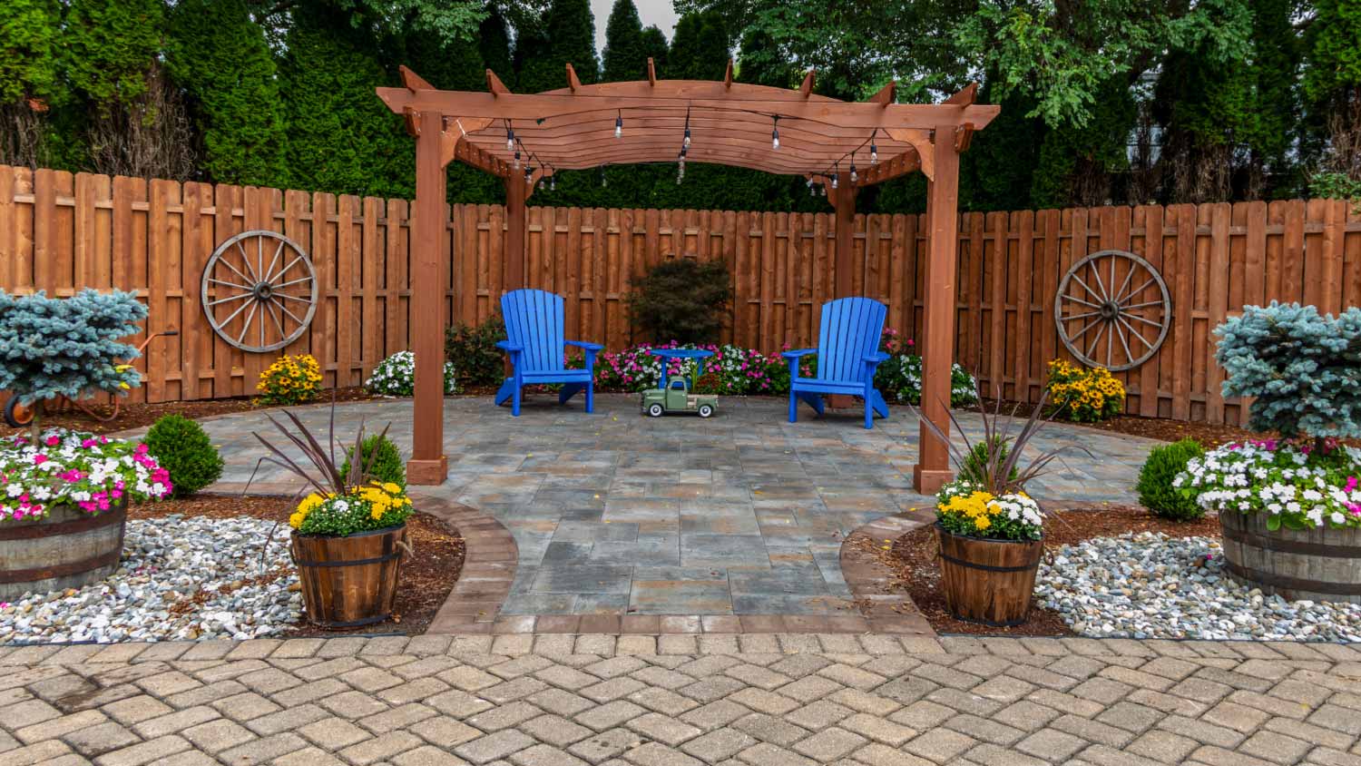 Wooden pergola on pavers landscape design