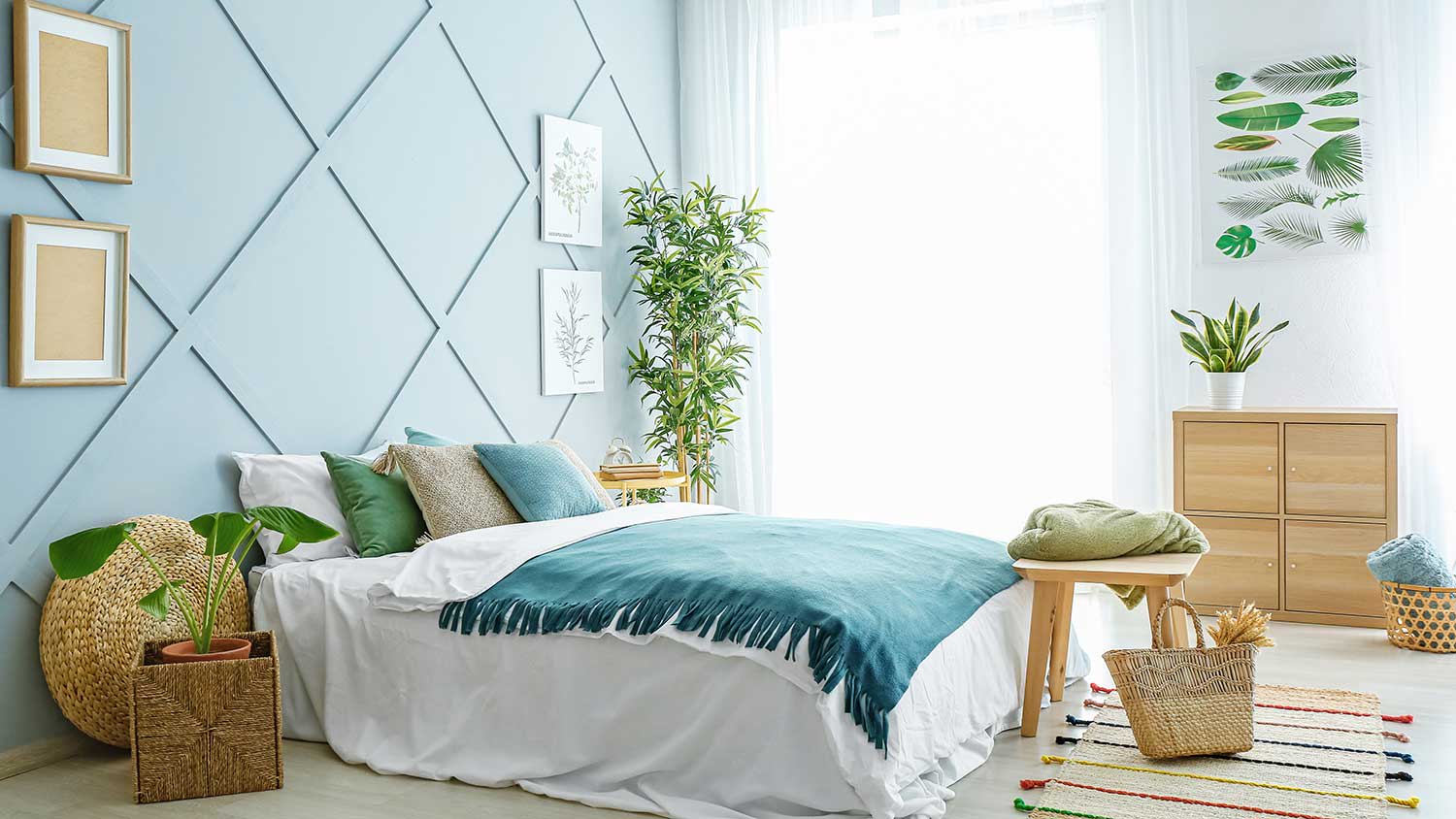 Bright bedroom with light blue accent wall