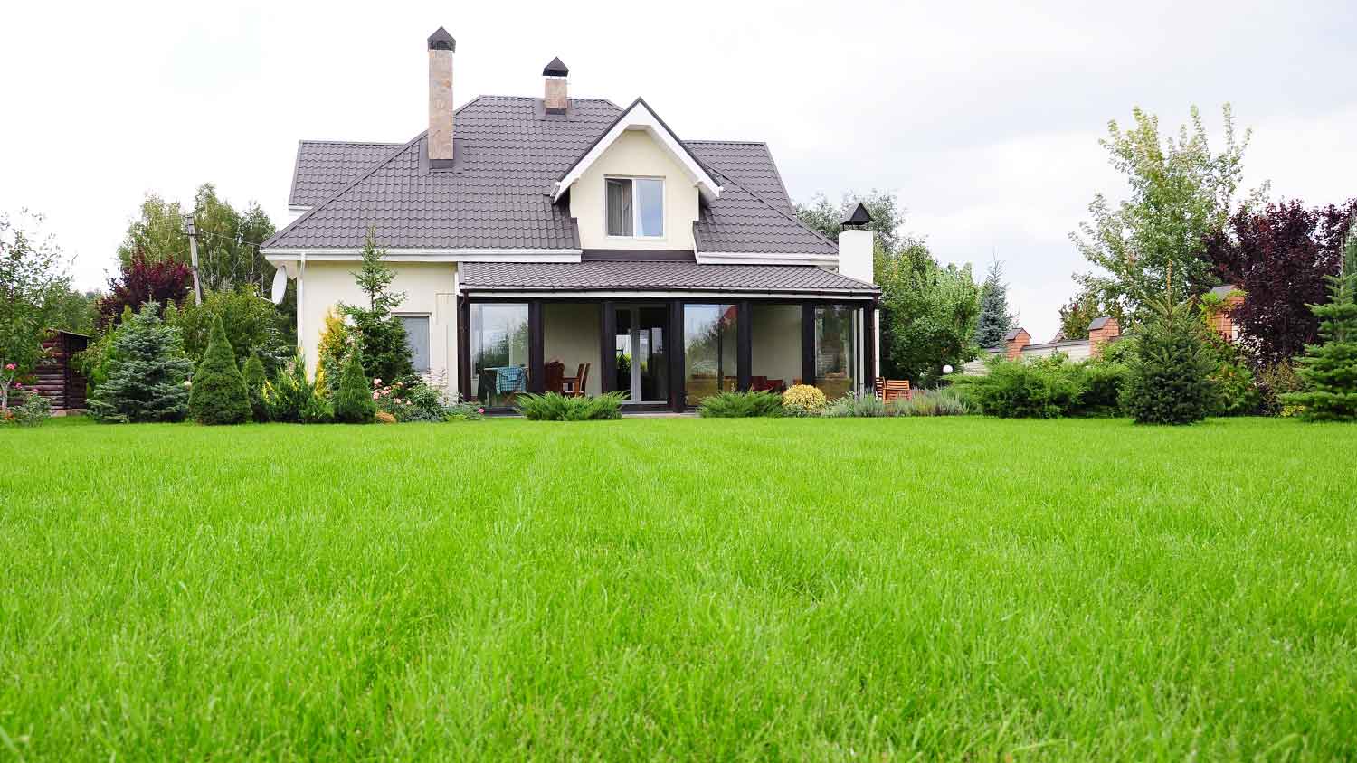 Modern house out in the country with a large backyard