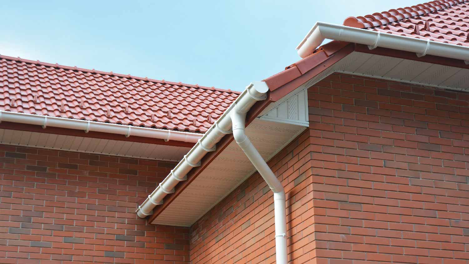 Gutters and downspouts in a brick house