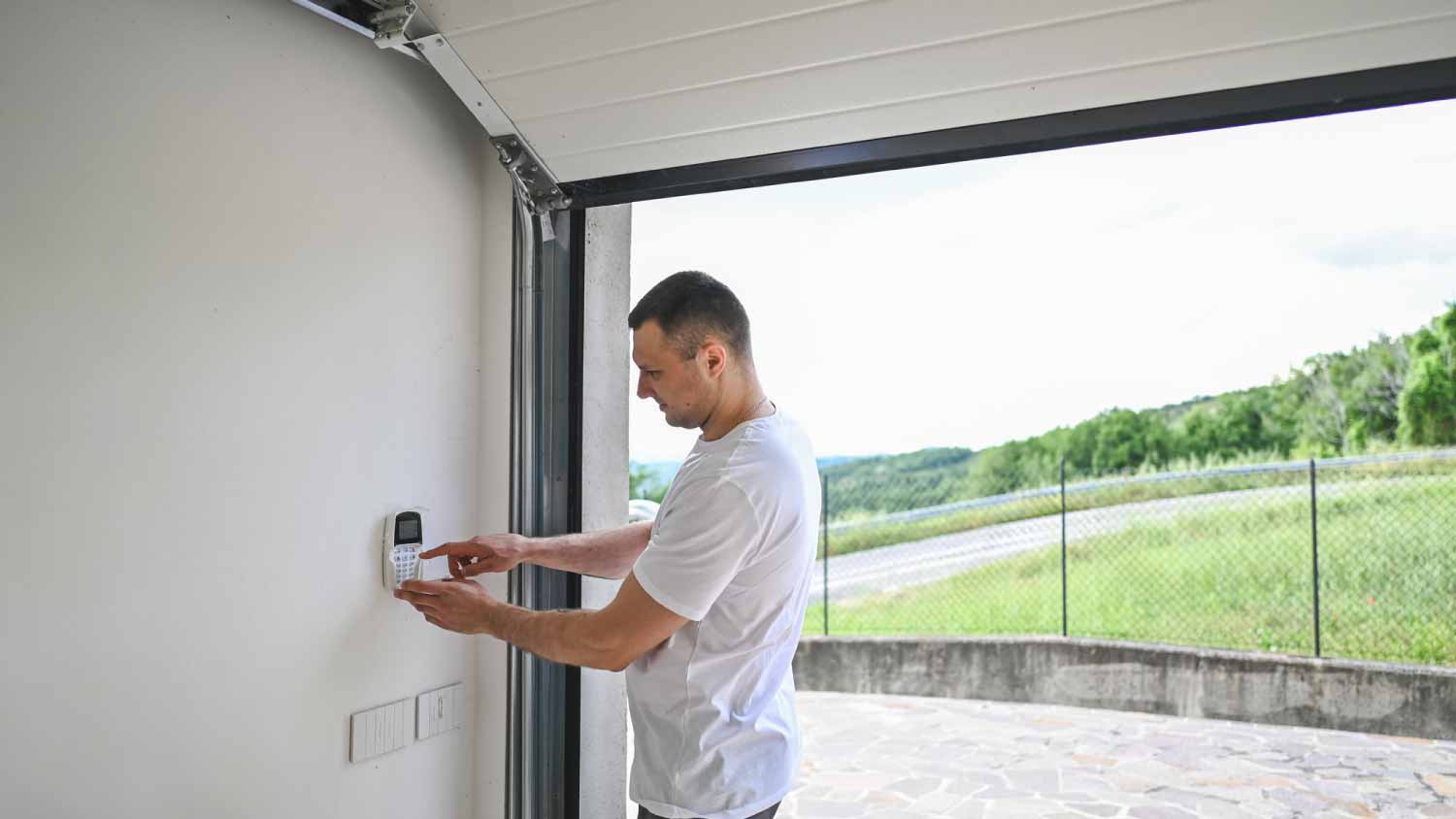 Man closing garage door