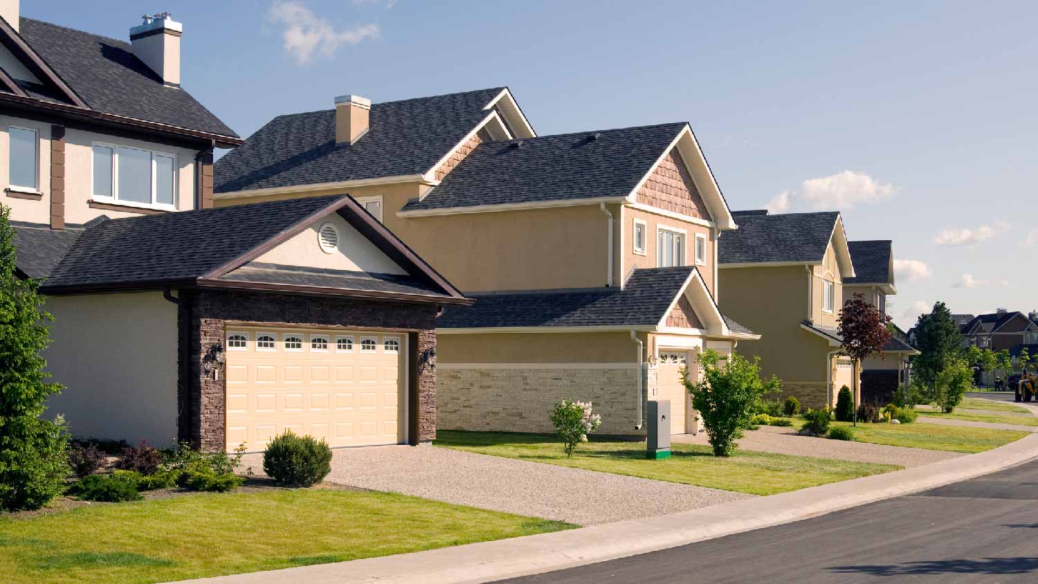 A house with a garage in a residential neighborhood