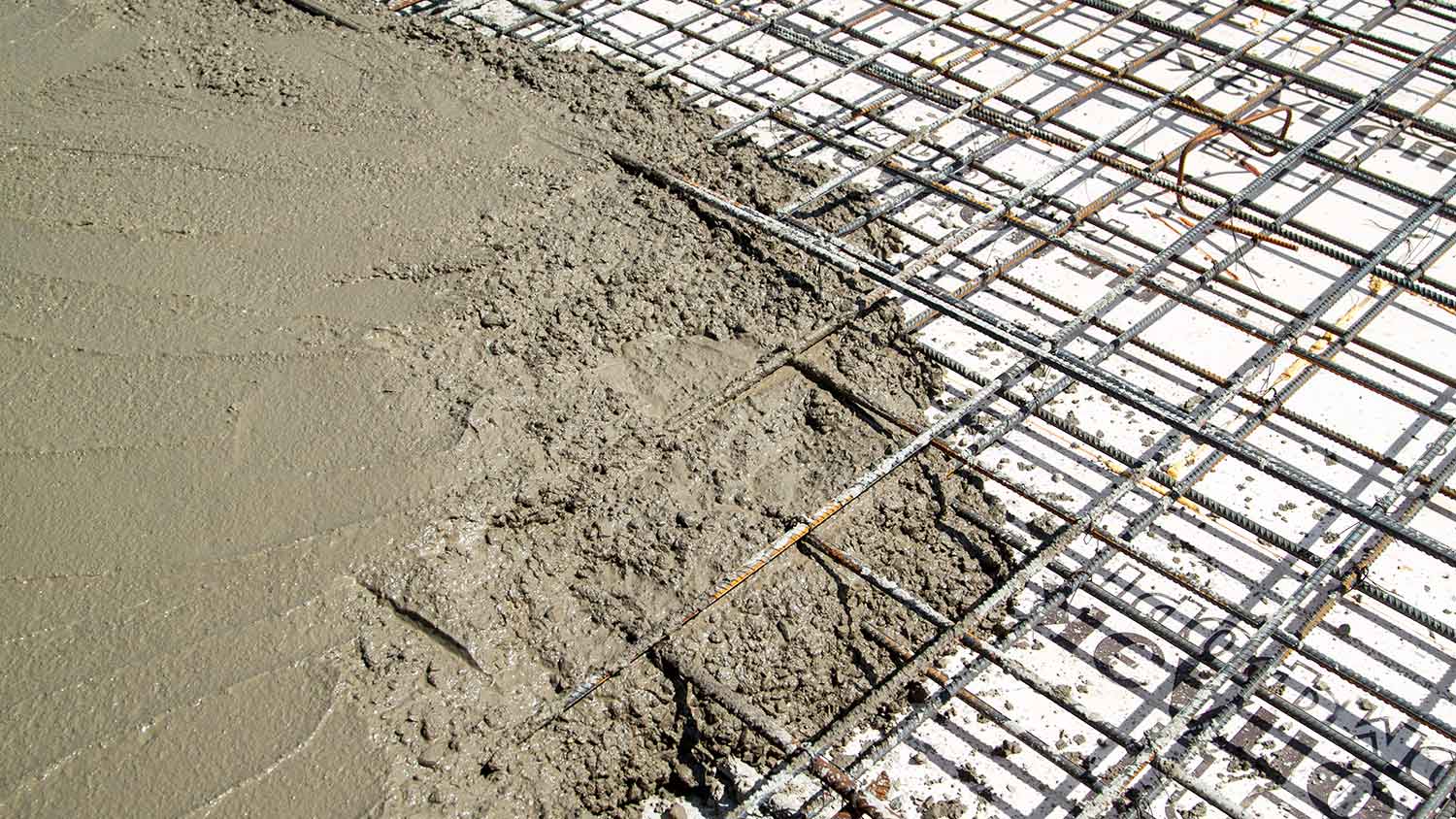Pouring concrete into a rebar-reinforced form