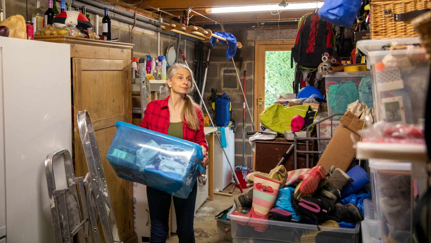 woman decluttering garage