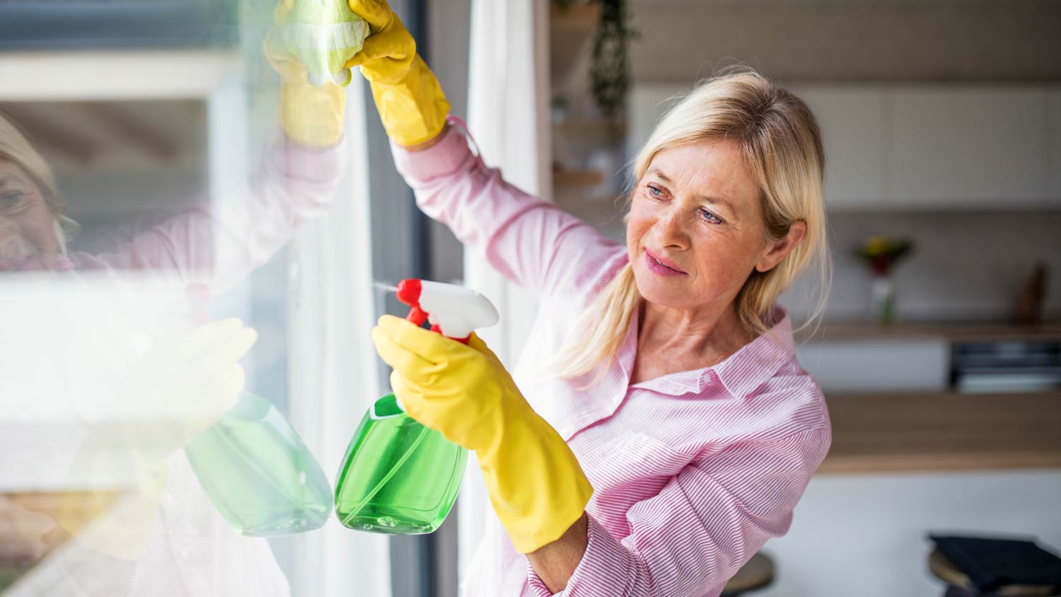 A woman cleaning windows