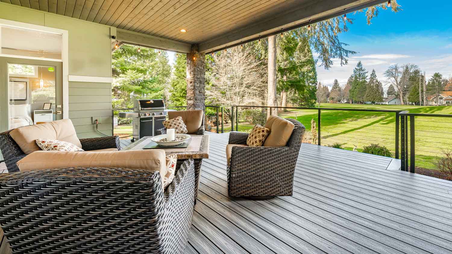 Covered deck with composite decking and outdoor furniture