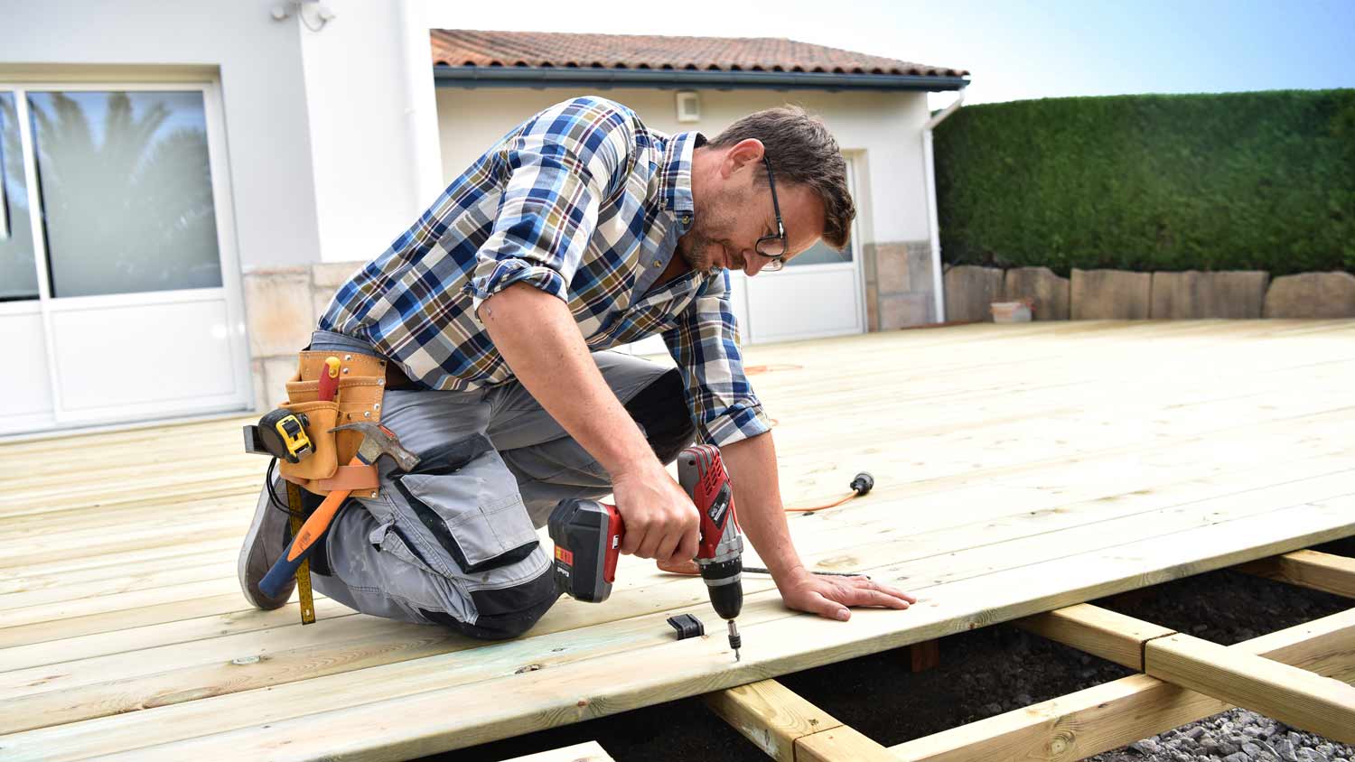 carpenter building wood deck
