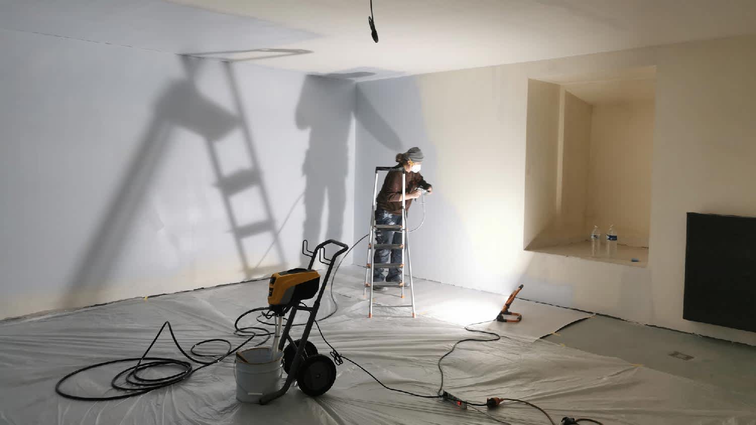 A woman turning a basement into a bedroom