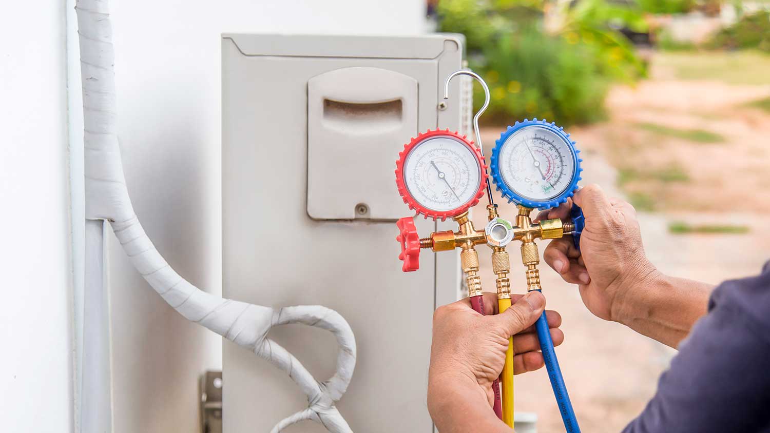 Technician checking mini split refrigerant levels