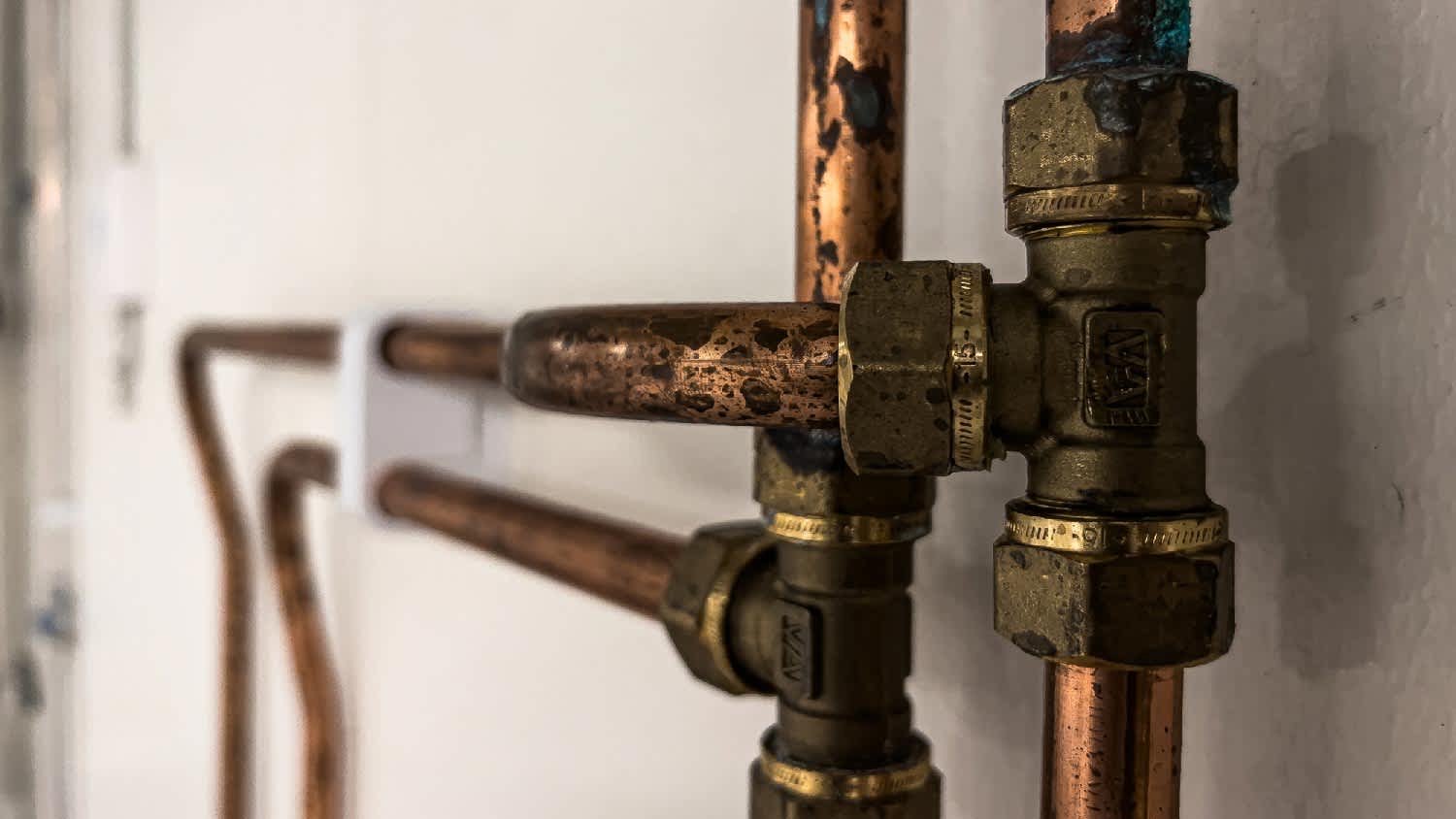 Close-up of corroded copper pipes