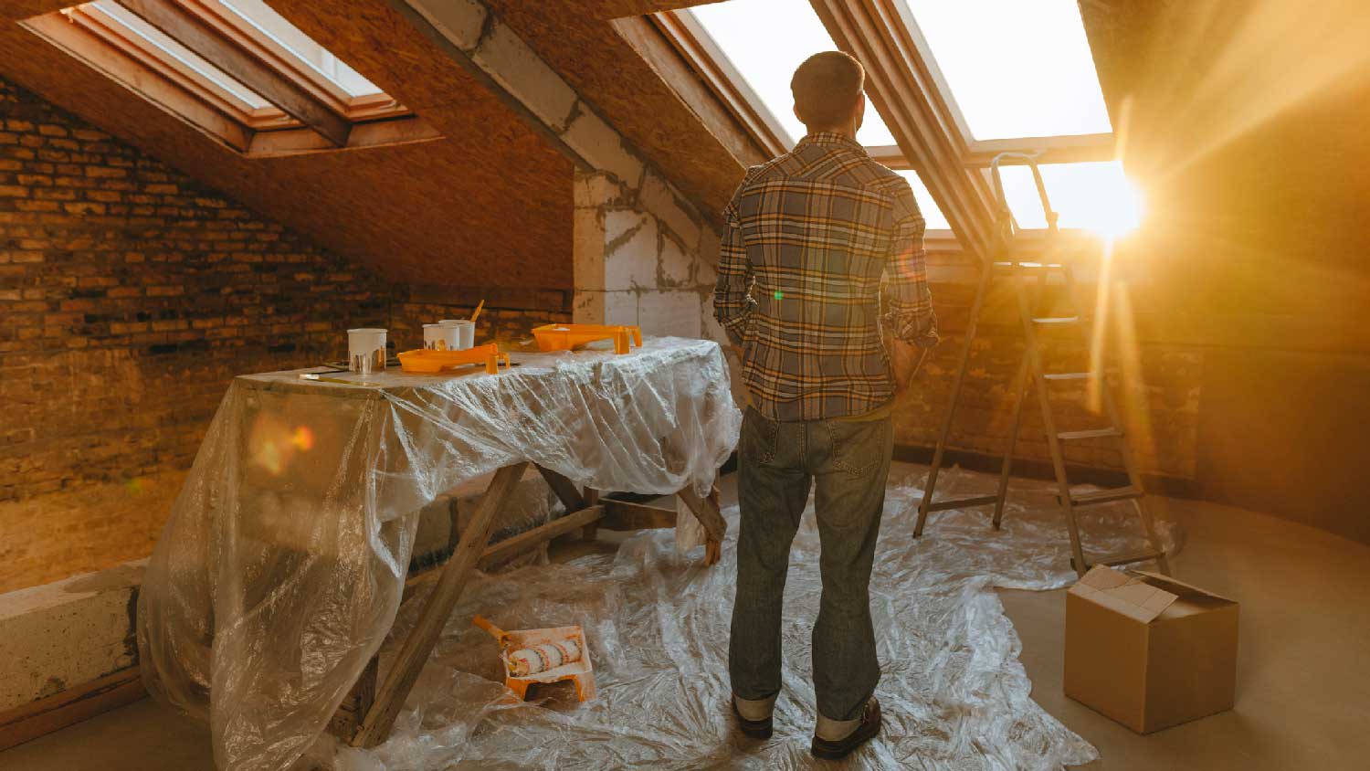 A man looking out a skylight having a glare
