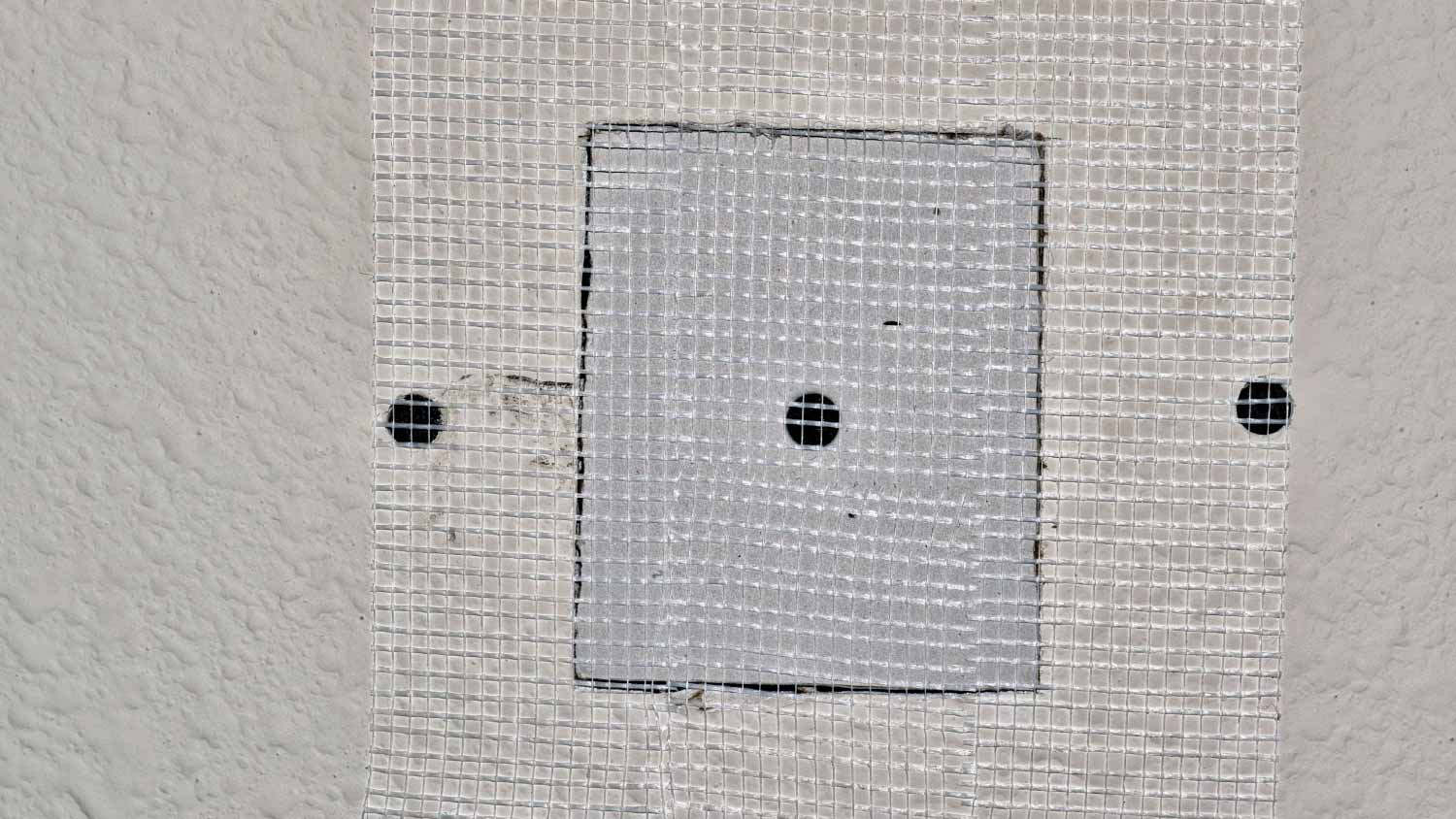 Fiberglass tape covering a square repair panel