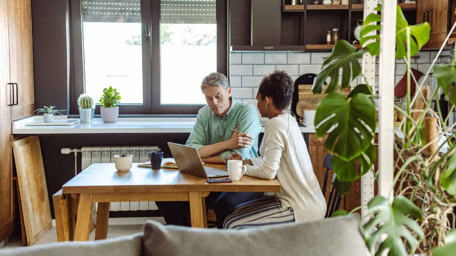A homeowner discussing insurance approval with agent