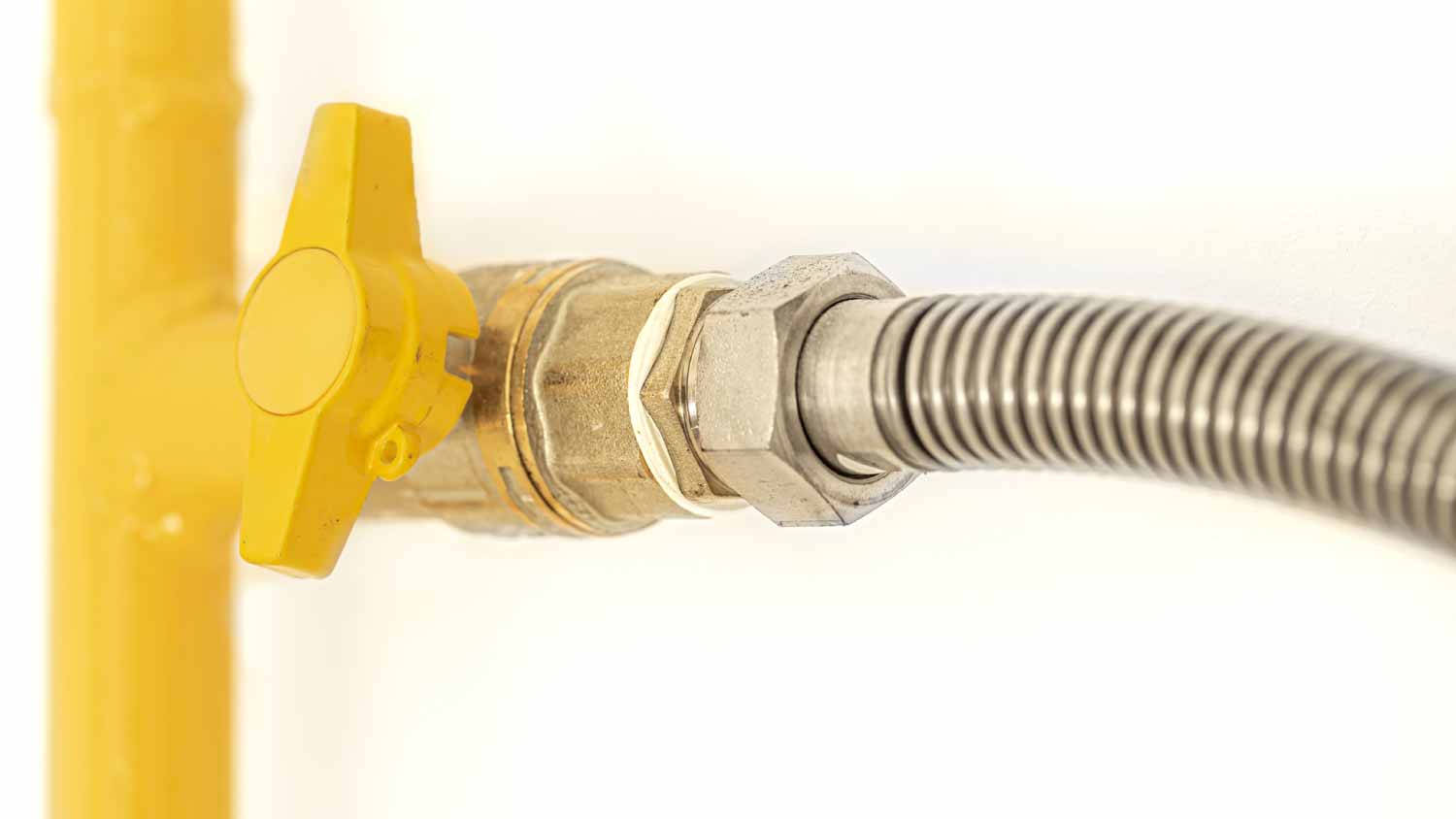 Yellow gas pipe with a valve
