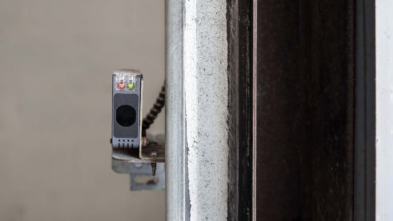 Close-up of a garage door sensor