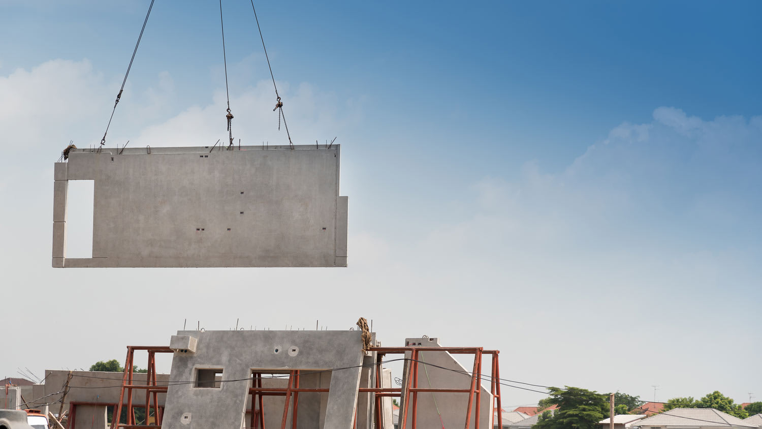 crane lifting precast concrete slab